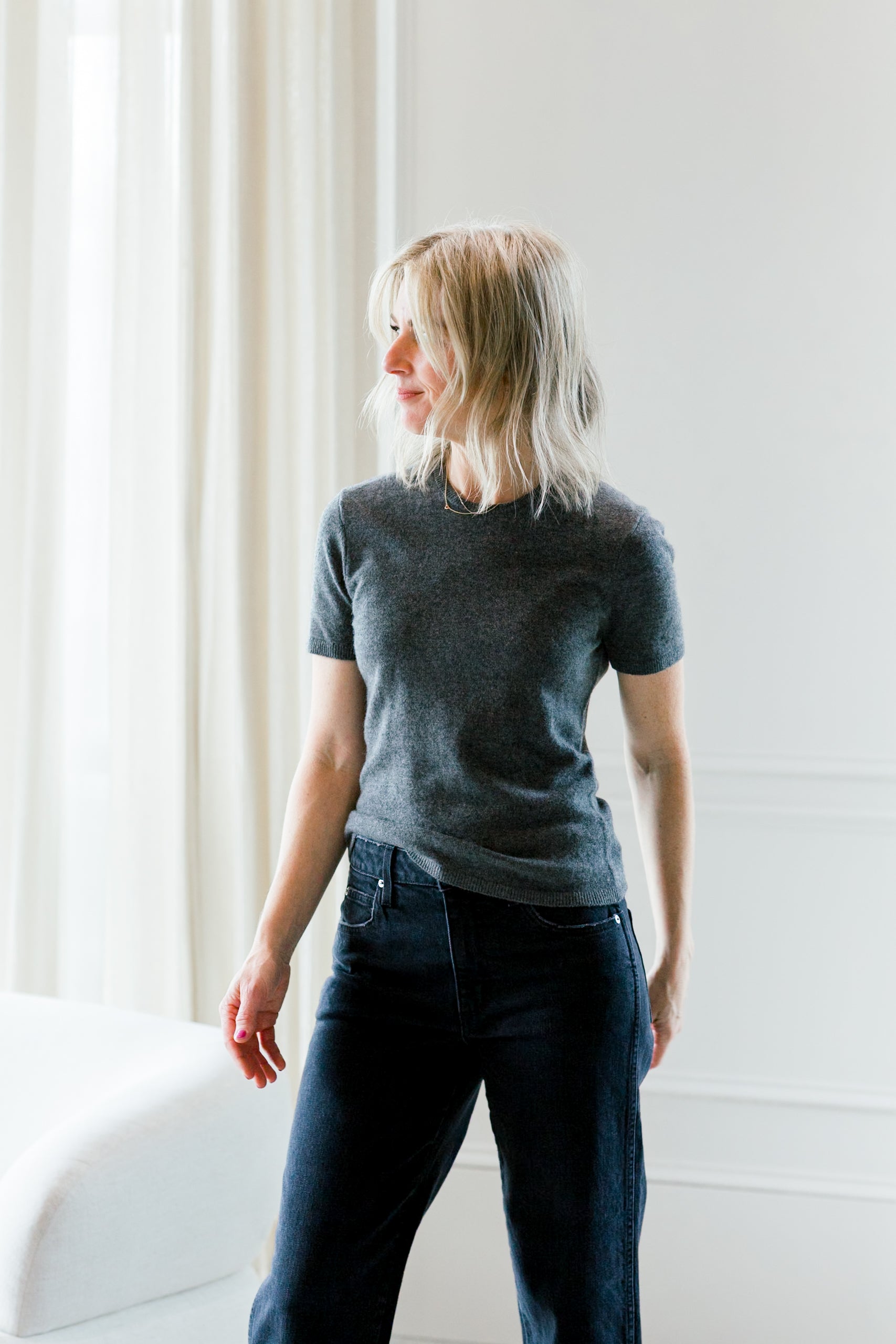 image of a woman wearing the garment como knit tee