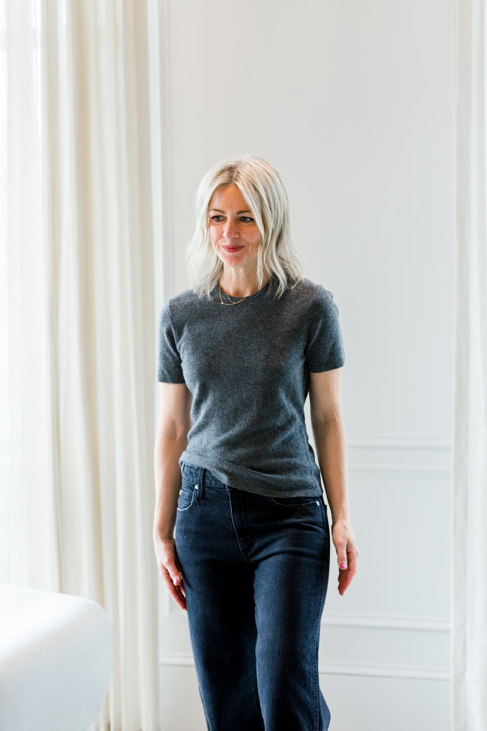 image of a woman wearing the garment como knit tee