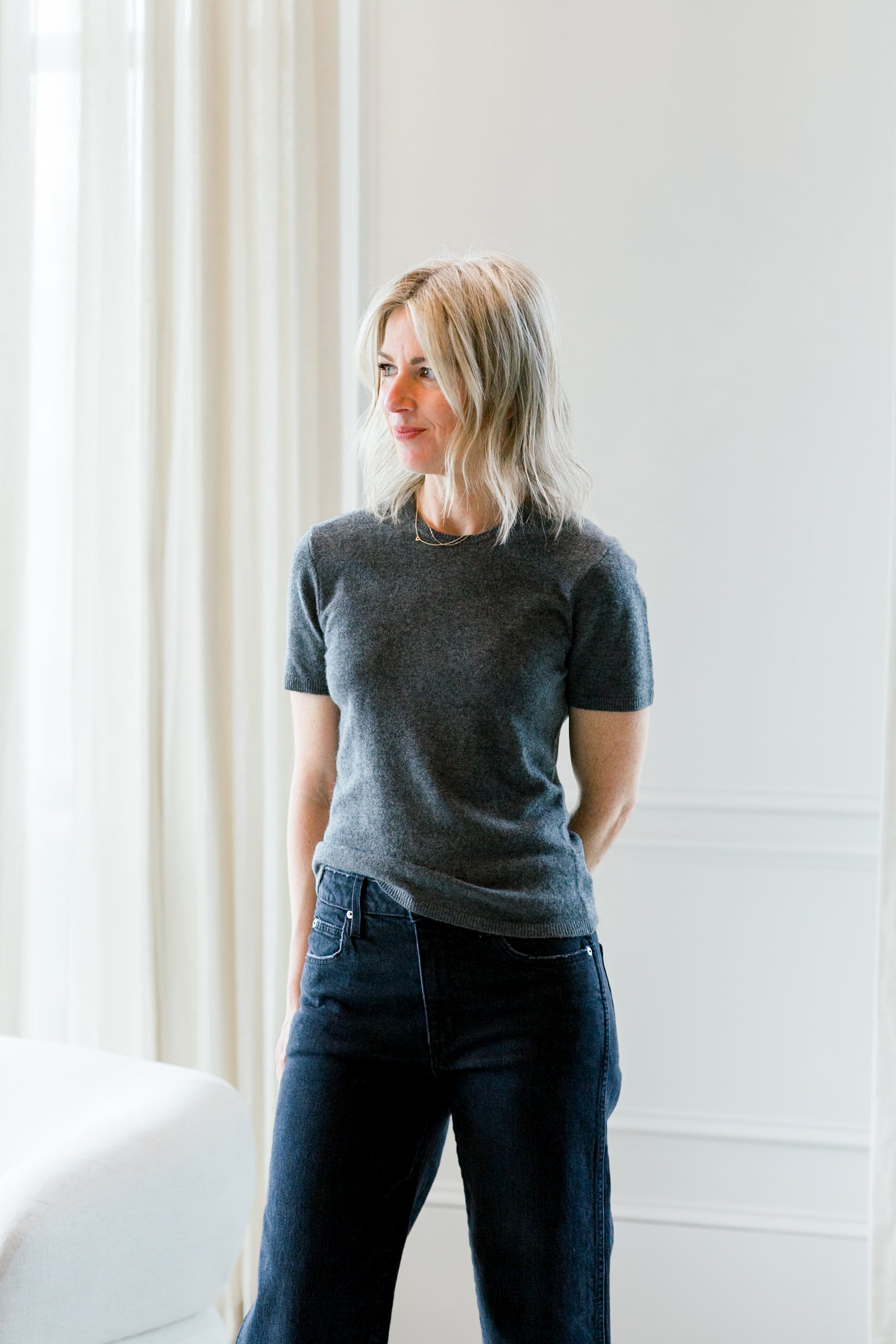 image of a woman wearing the garment como knit tee