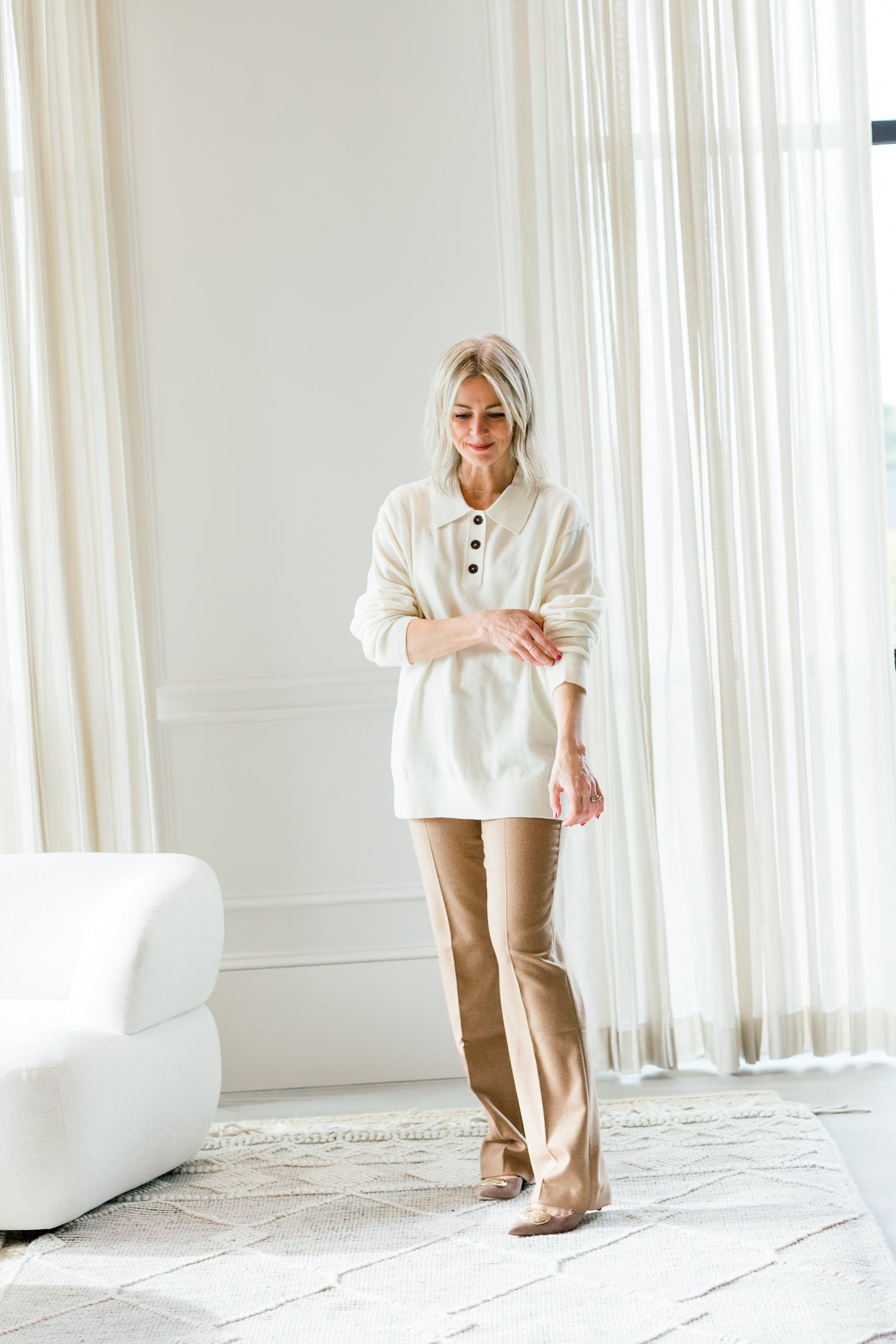 image of a woman wearing the garment como polo sweater