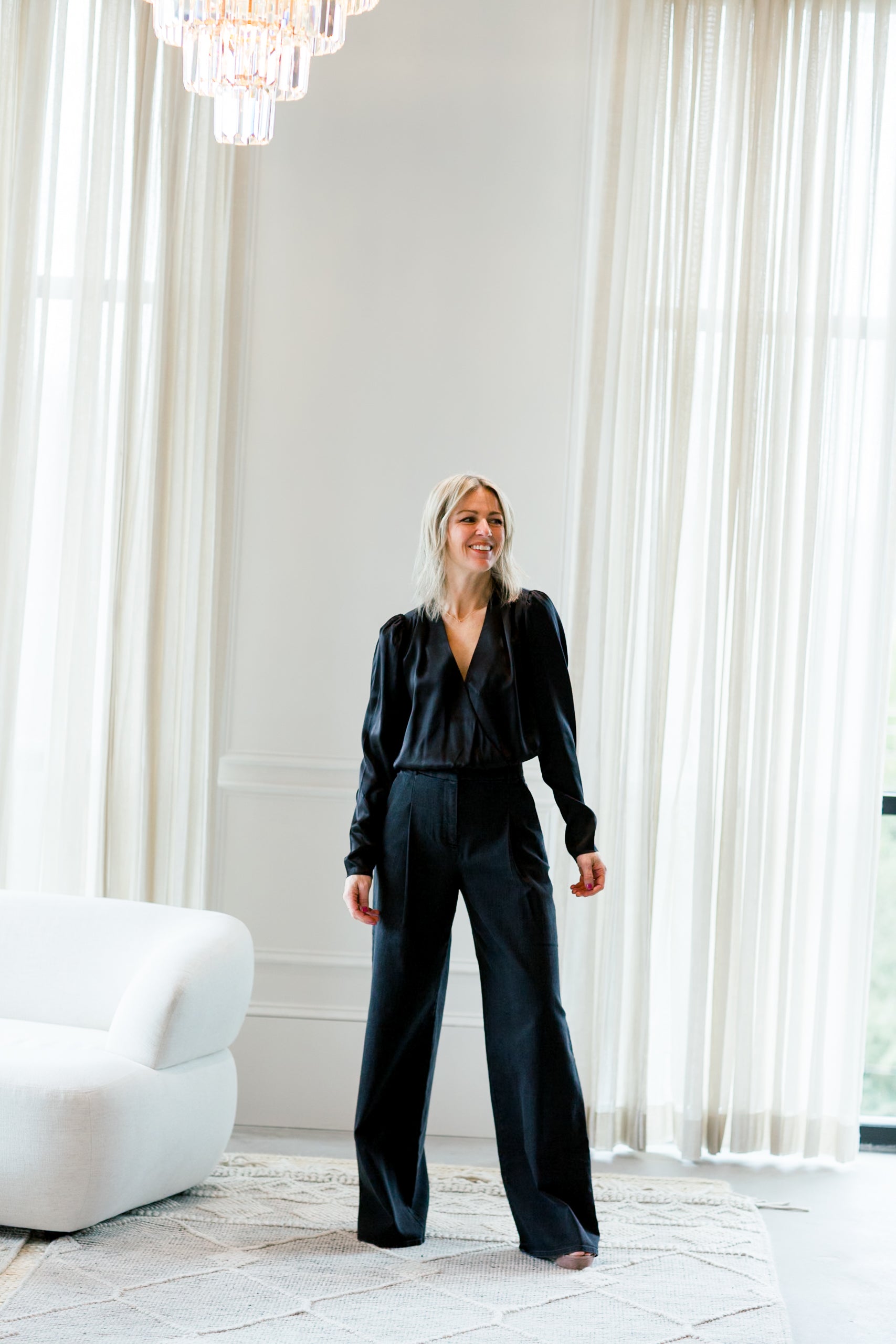 image of a woman wearing the garment merci anagram pants