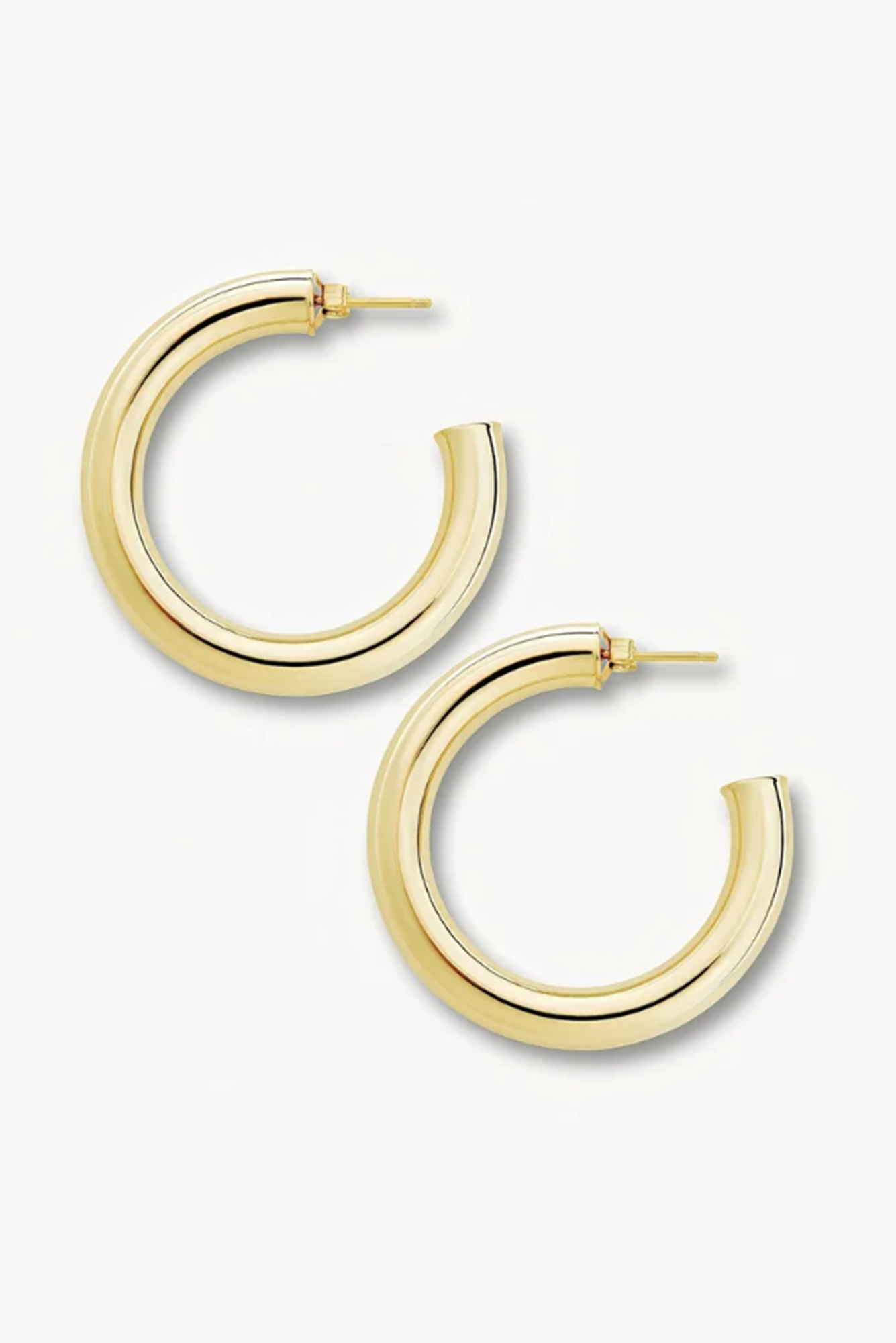 Gold hoop earrings on a white background