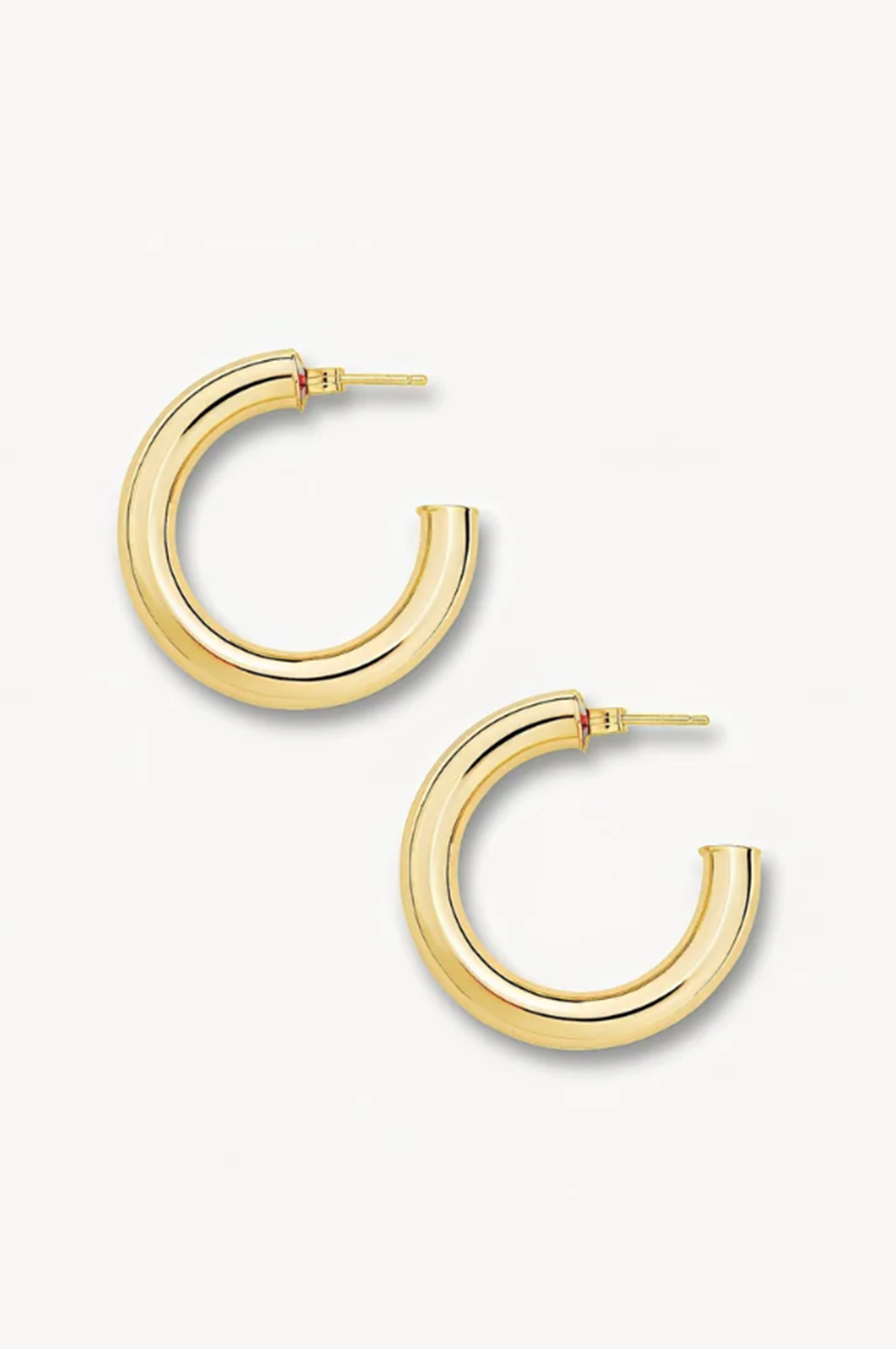 Gold hoop earrings on a white background