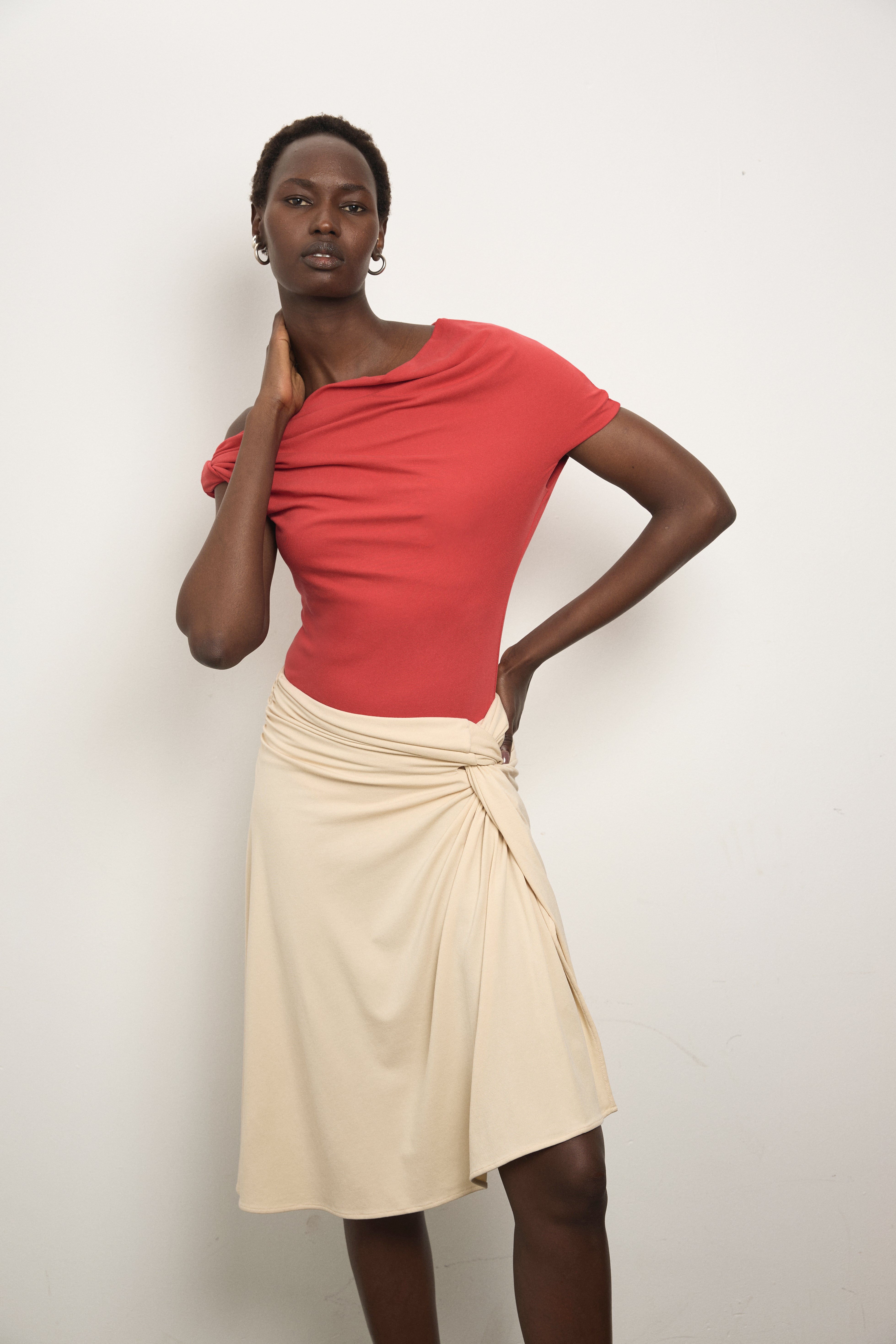 Model wearing Paris Georgia Ida Top in red