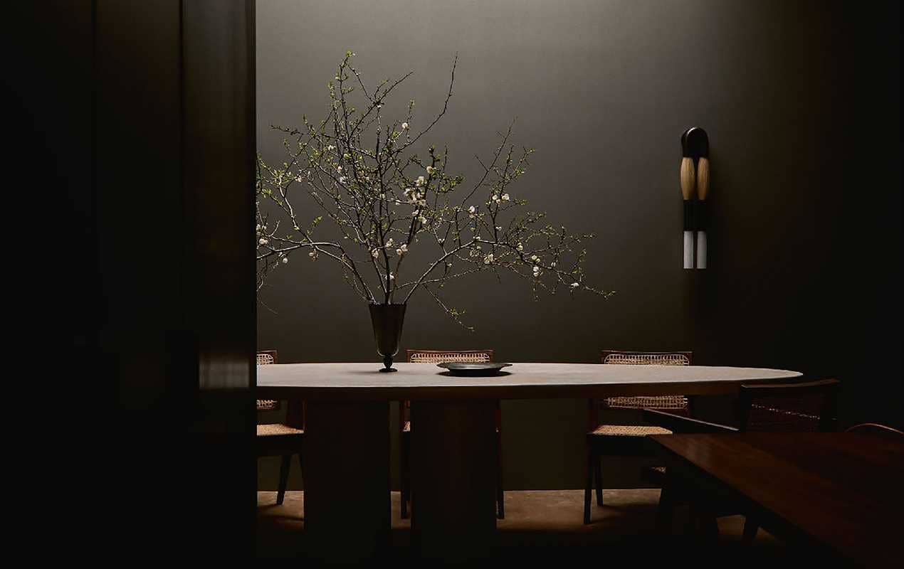 Dining room with the dark elegance suited for of ‘Young Visionaries: A New Generation of Interior Designers' by Beta Plus as a coffee table book.