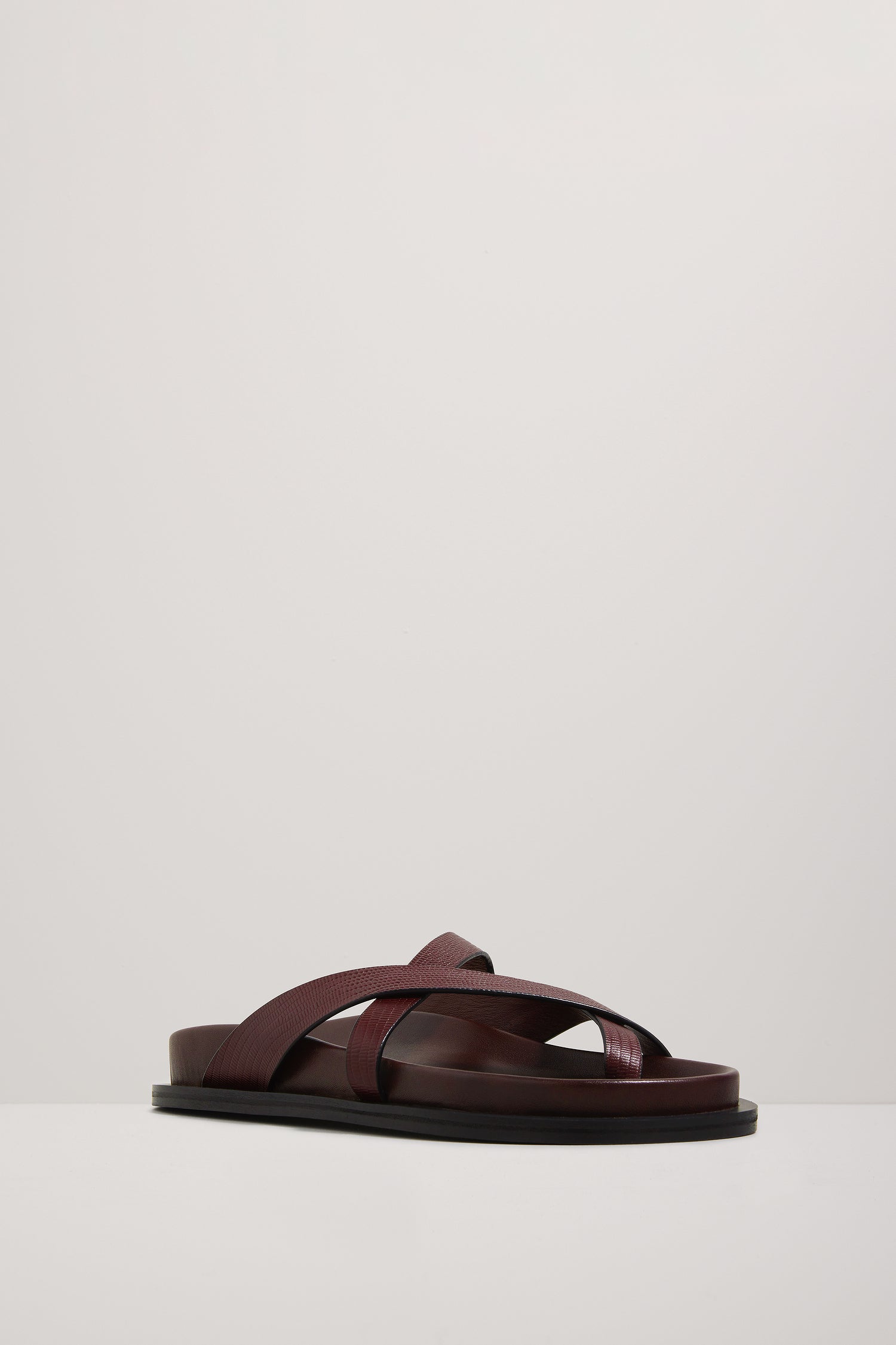 Brown sandal on a light gray background
