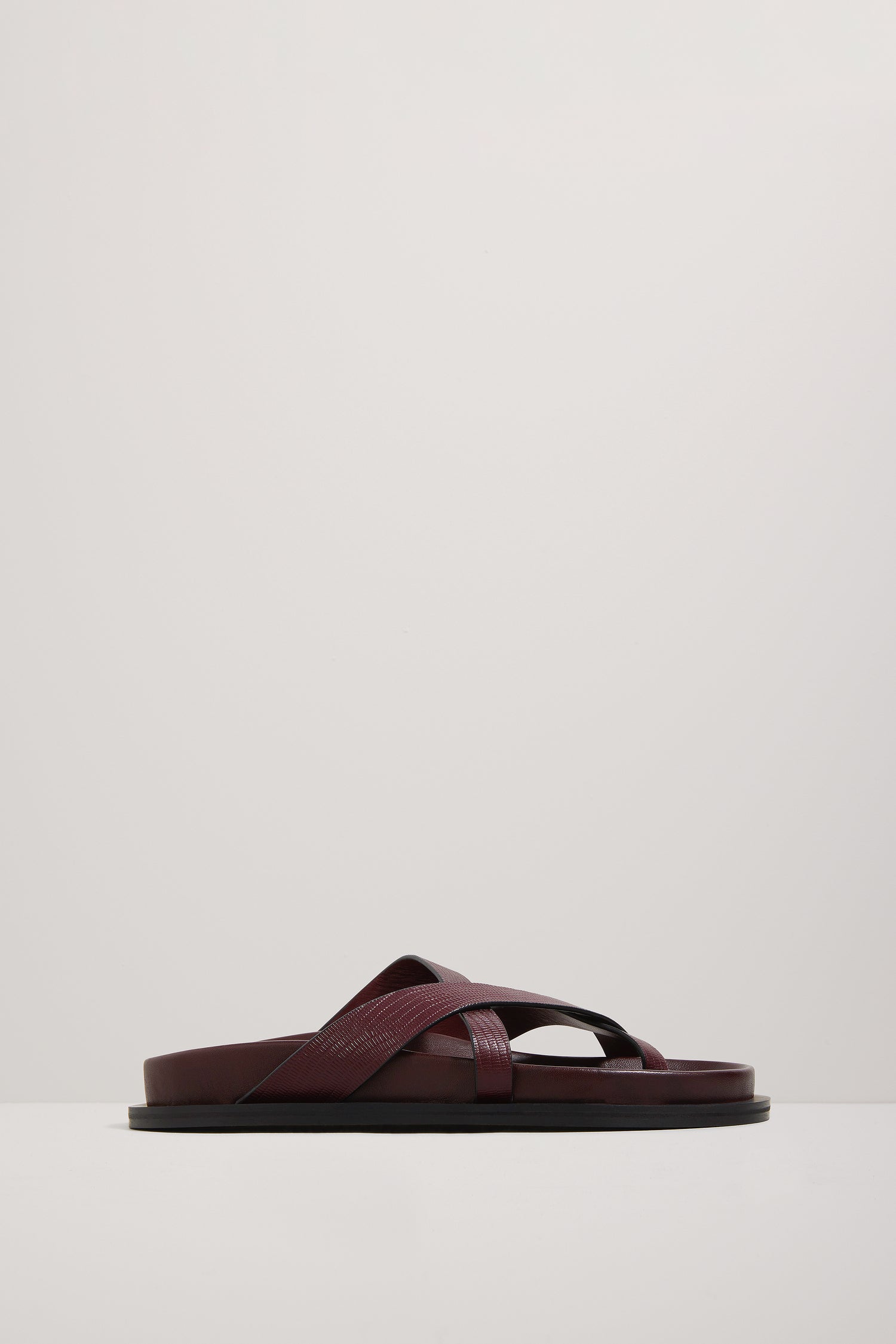 Brown sandal on a light gray background