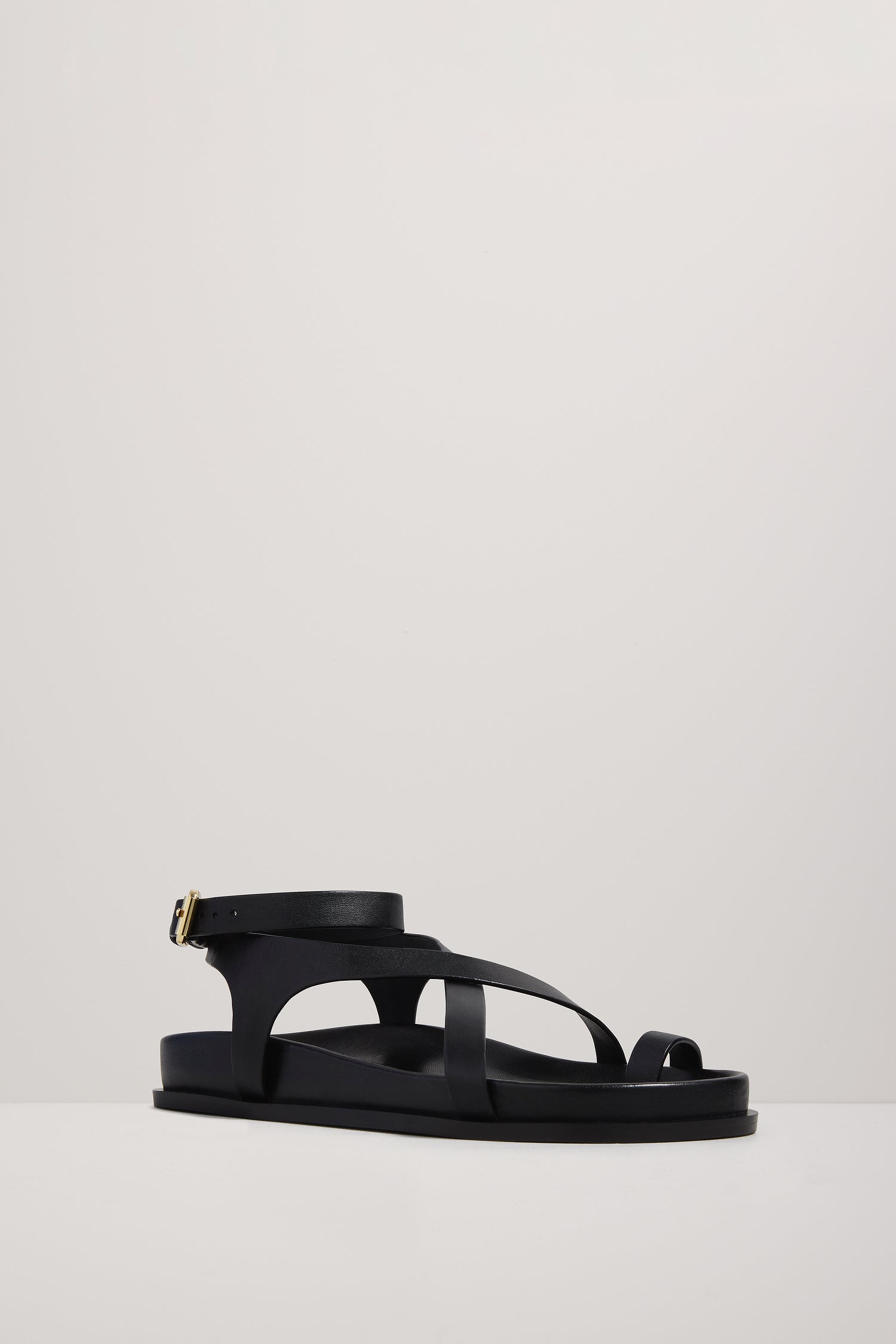 Black sandal on a light gray background