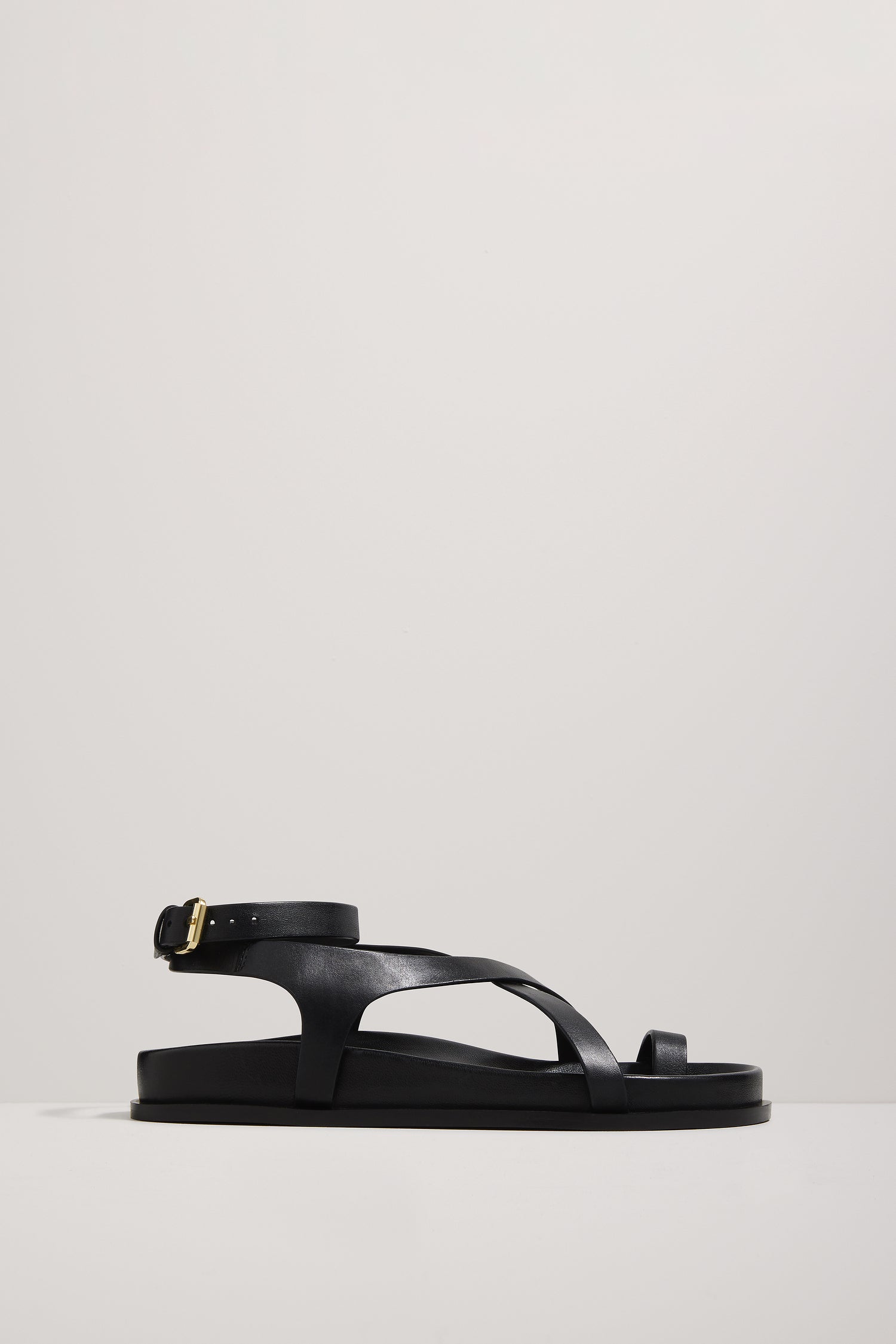 Black sandal on a light gray background