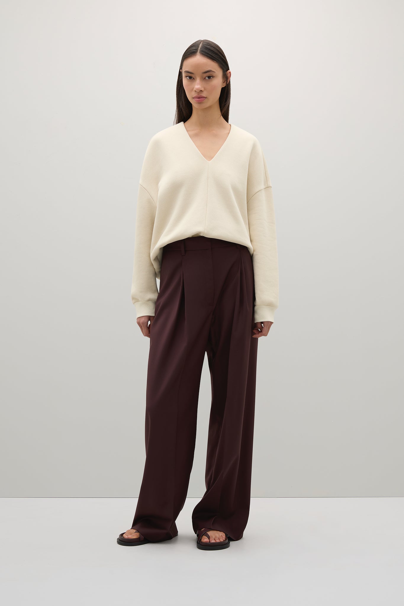 image of a woman wearing the A Emery Willis Sweatshirt and Trousers