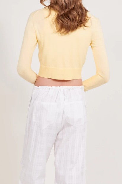 back image of a model wearing the Alfie Grace Pant in white checkered