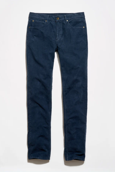 A pair of dark blue denim jeans laid flat against a clean white background.