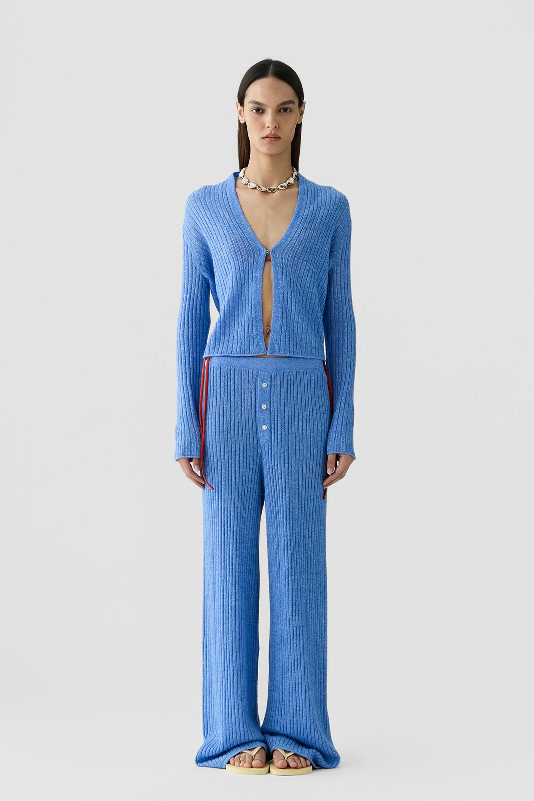 image of a woman wearing the Guest in Residence Rib Stealth Cardigan in Delft Blue