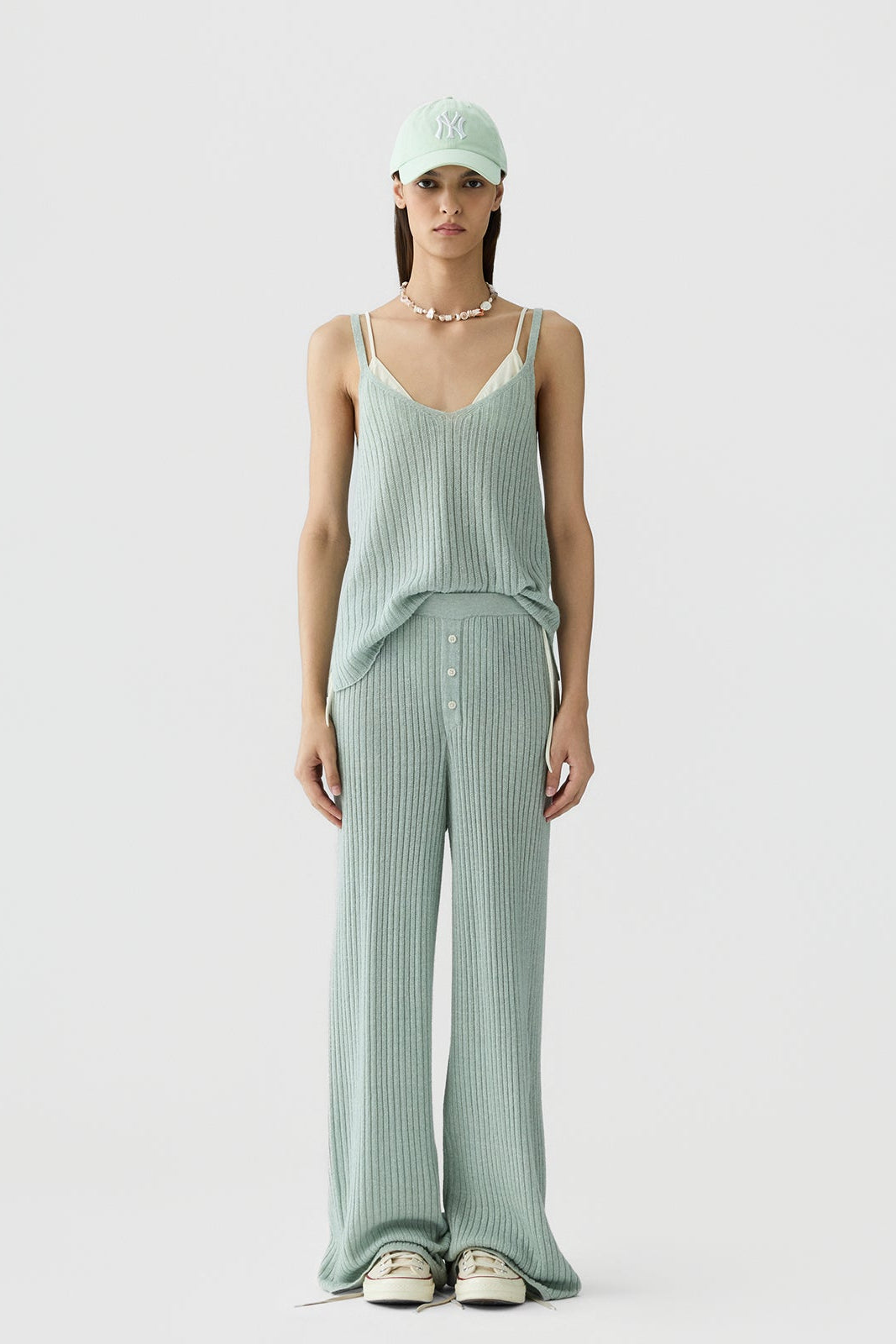 image of a model wearing the Guest in Residence Breezy Rib Tank in Sage Brush
