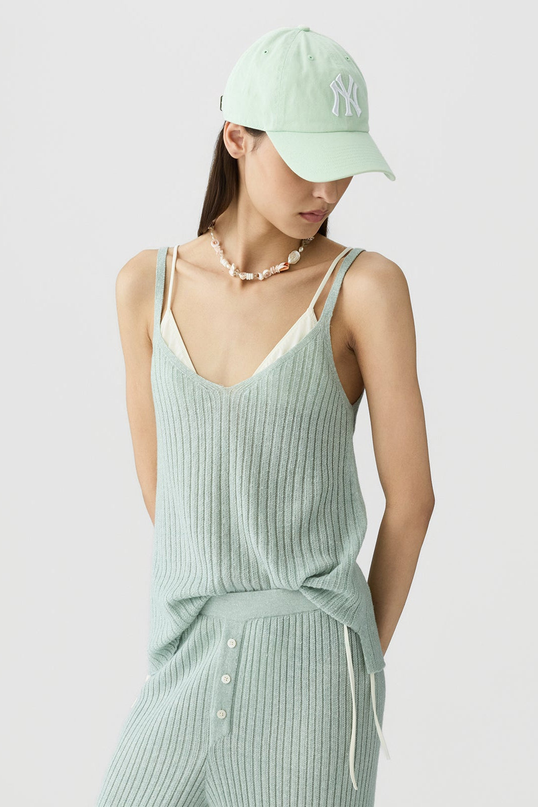 image of a model wearing the Guest in Residence Breezy Rib Tank in Sage Brush