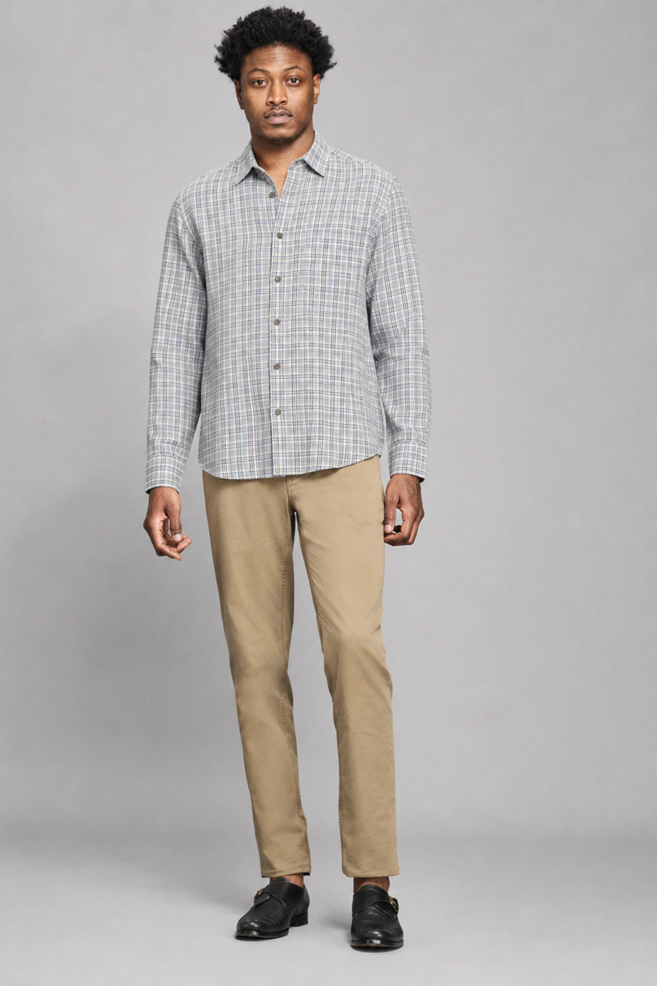 A man modeling a Billy Reid Twill Plaid Hutcheson Sport Shirt standing against a white background