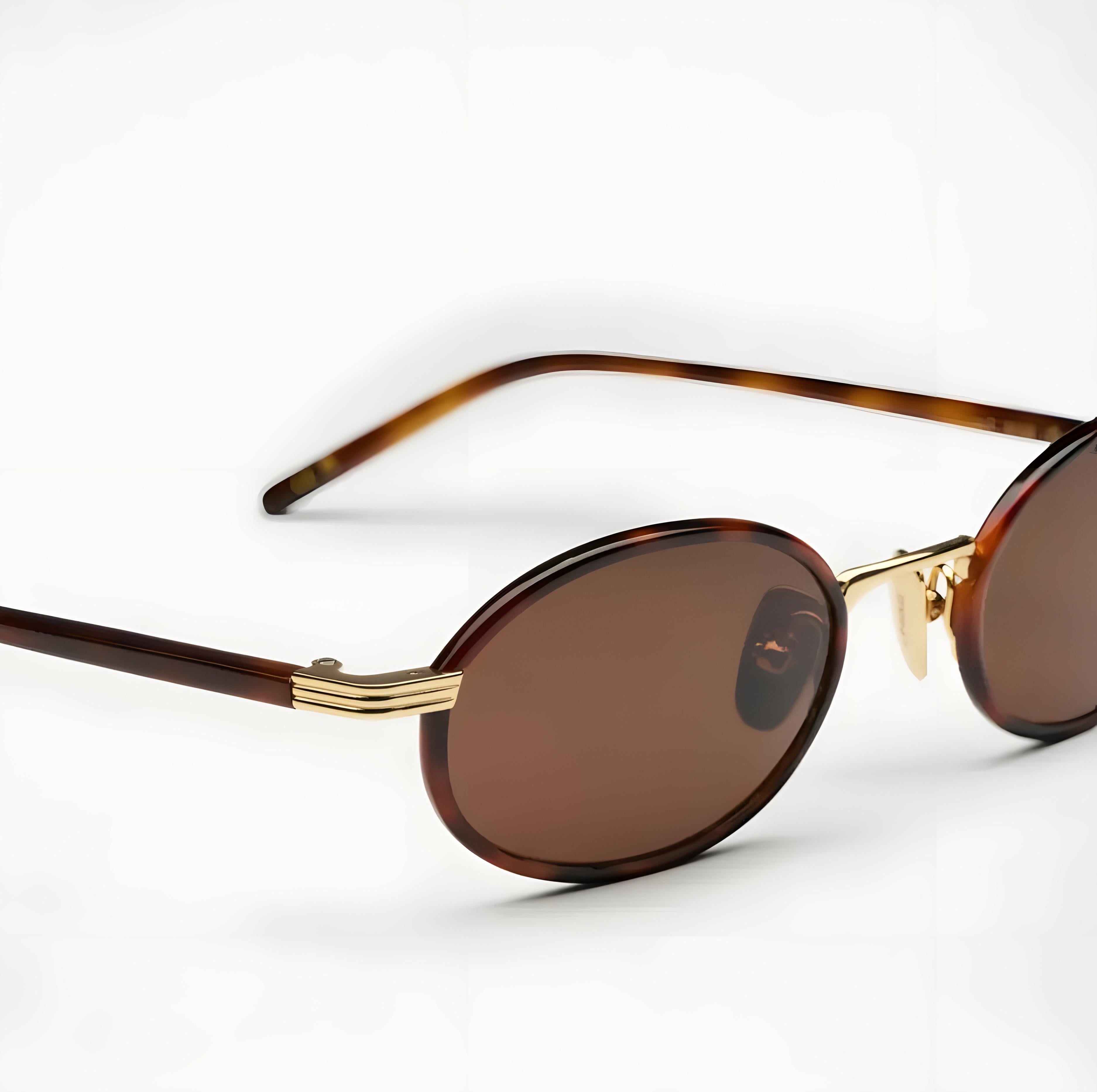Sunglasses with tortoiseshell frame and brown lenses on a white background