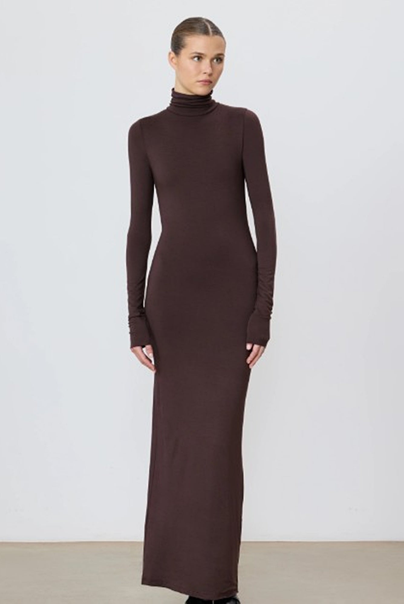 model wearing the eterne turtleneck dress in espresso