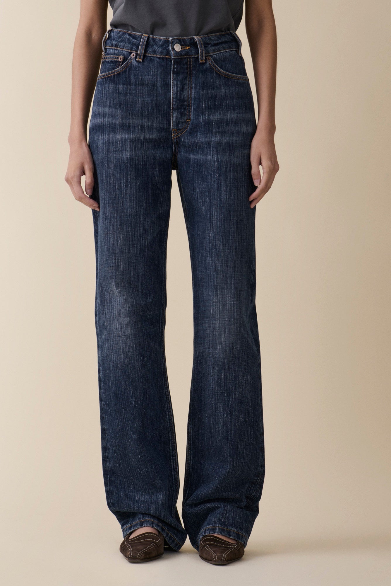 image of a model wearing the Jeanerica Virgo Jeans in Dark Blue Righe