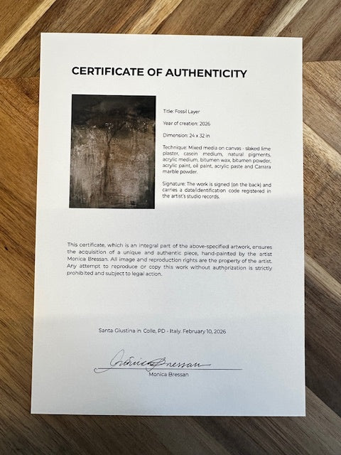 Certificate of Authenticity on a wooden surface