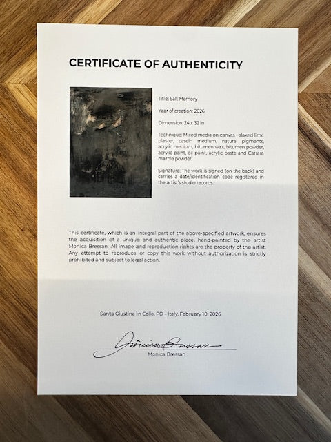 Certificate of Authenticity on a wooden surface