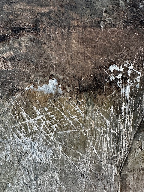Close-up of ancient rock carvings on a textured stone surface
