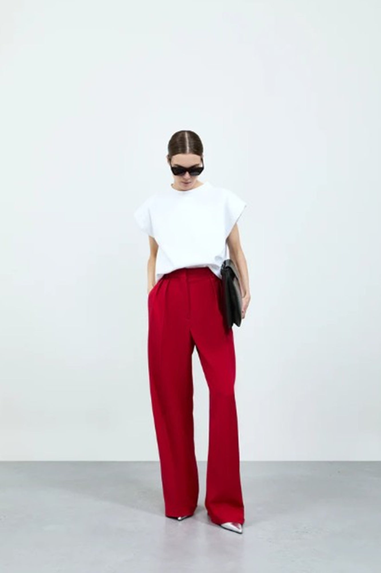 image of a model wearing the Rhune Celine Pants in Red