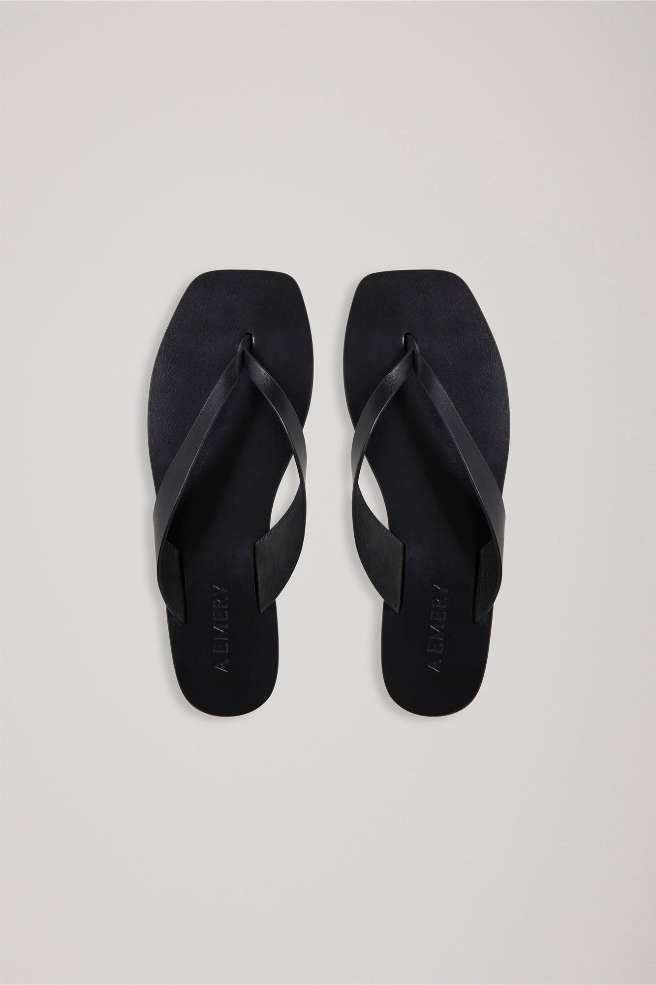 A Emery Kinto Sandal in Black against a white background