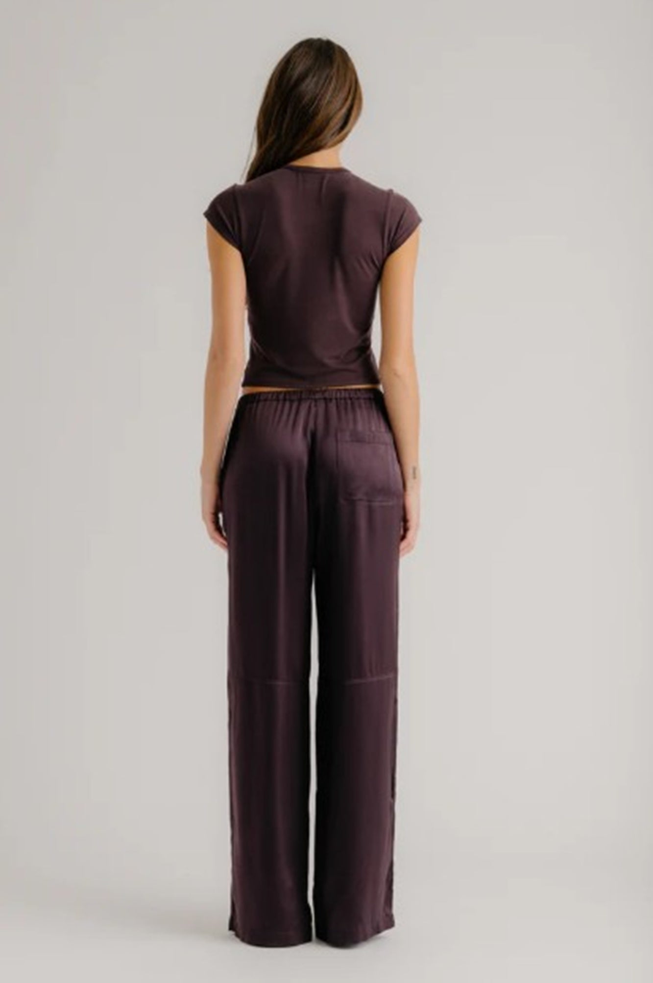 back image of a model wearing the Sablyn Lexi Silk Pants in Oak Tree