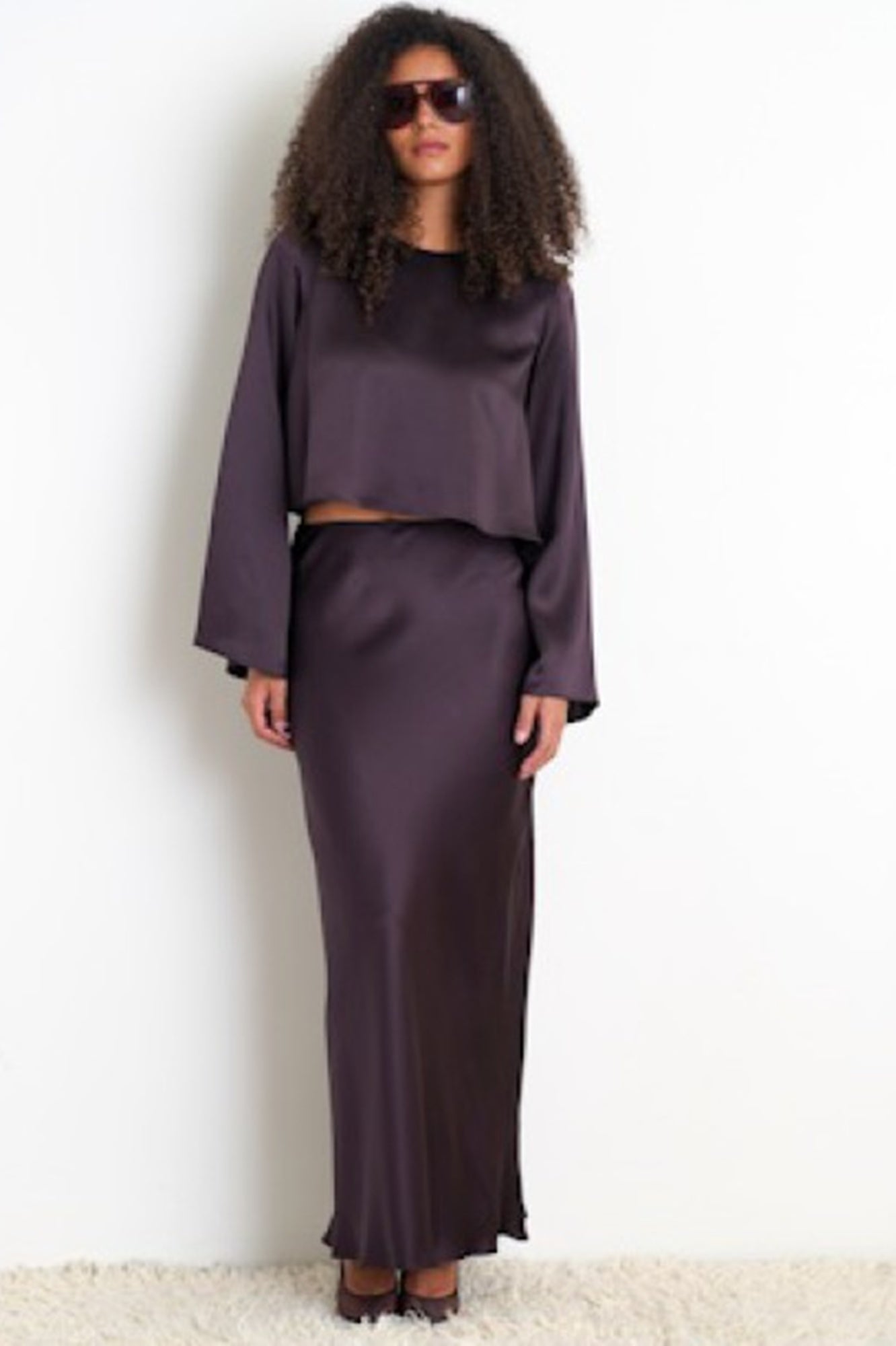 image of a model wearing the Sablyn Sonya Flowy Top in Oak Tree