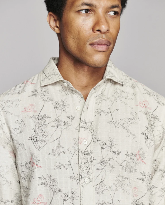 Close up of a man wearing the Billy Reid Cardinal Grid Cedar Shirt against a white background