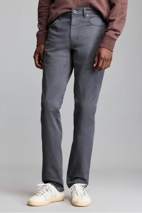 Man wearing the Billy Reid Cochran Jean in Asphalt standing against a white background
