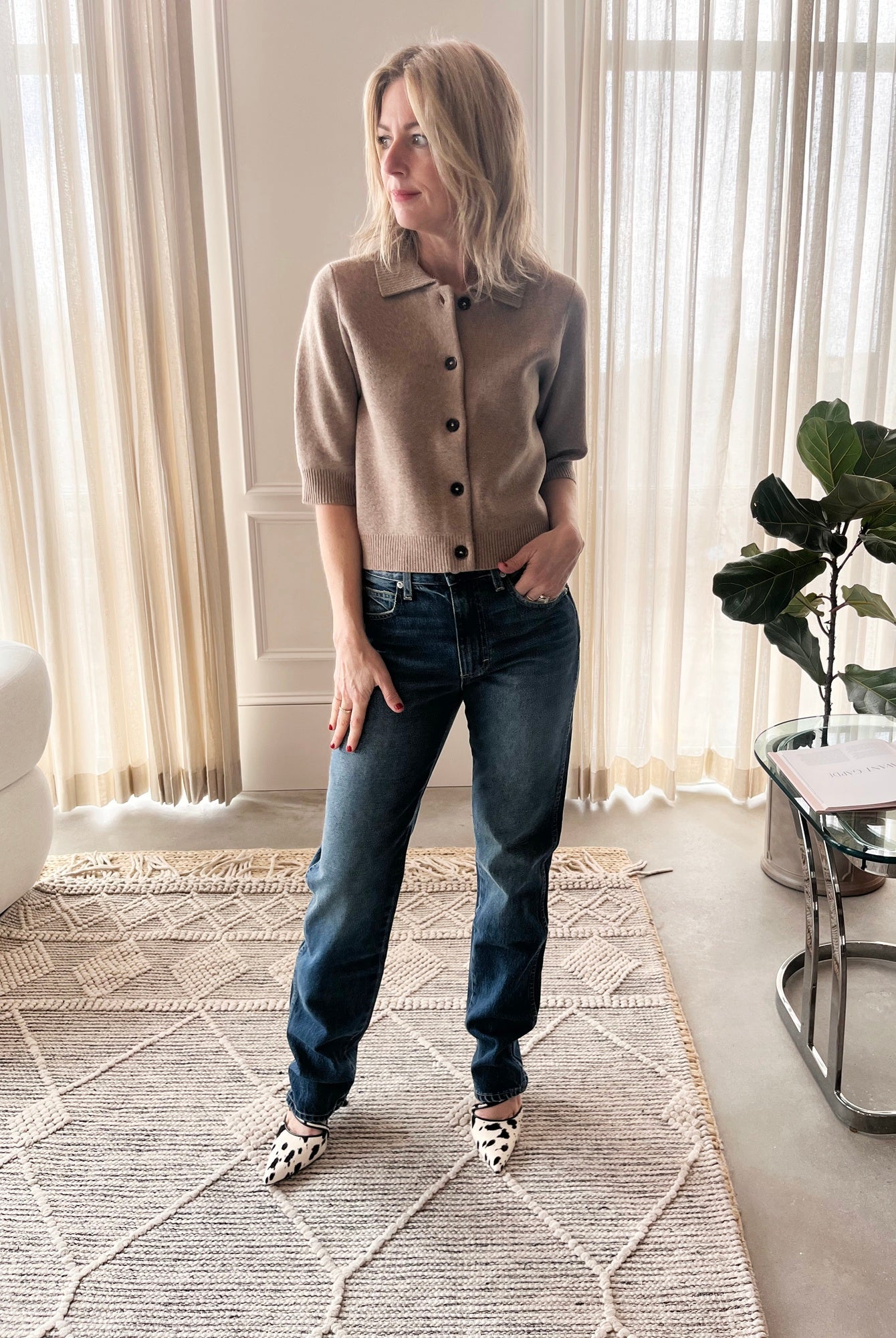 image of a woman wearing the Garment Como Cropped Cardigan, Amo Mira Jeans and Studio Amelia Alto Cow Mules