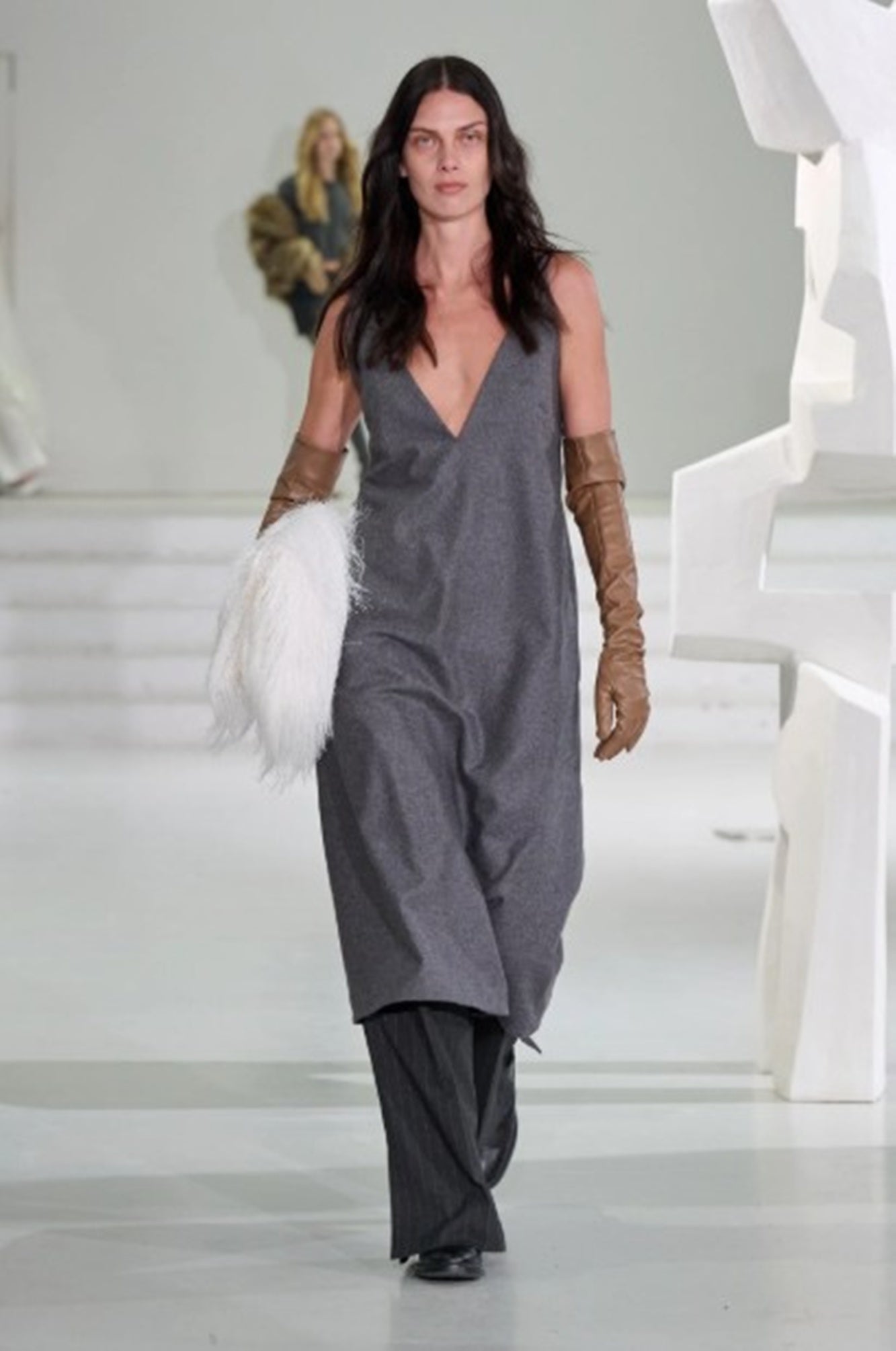 A model wearing the Garment Mitch dress on the runway