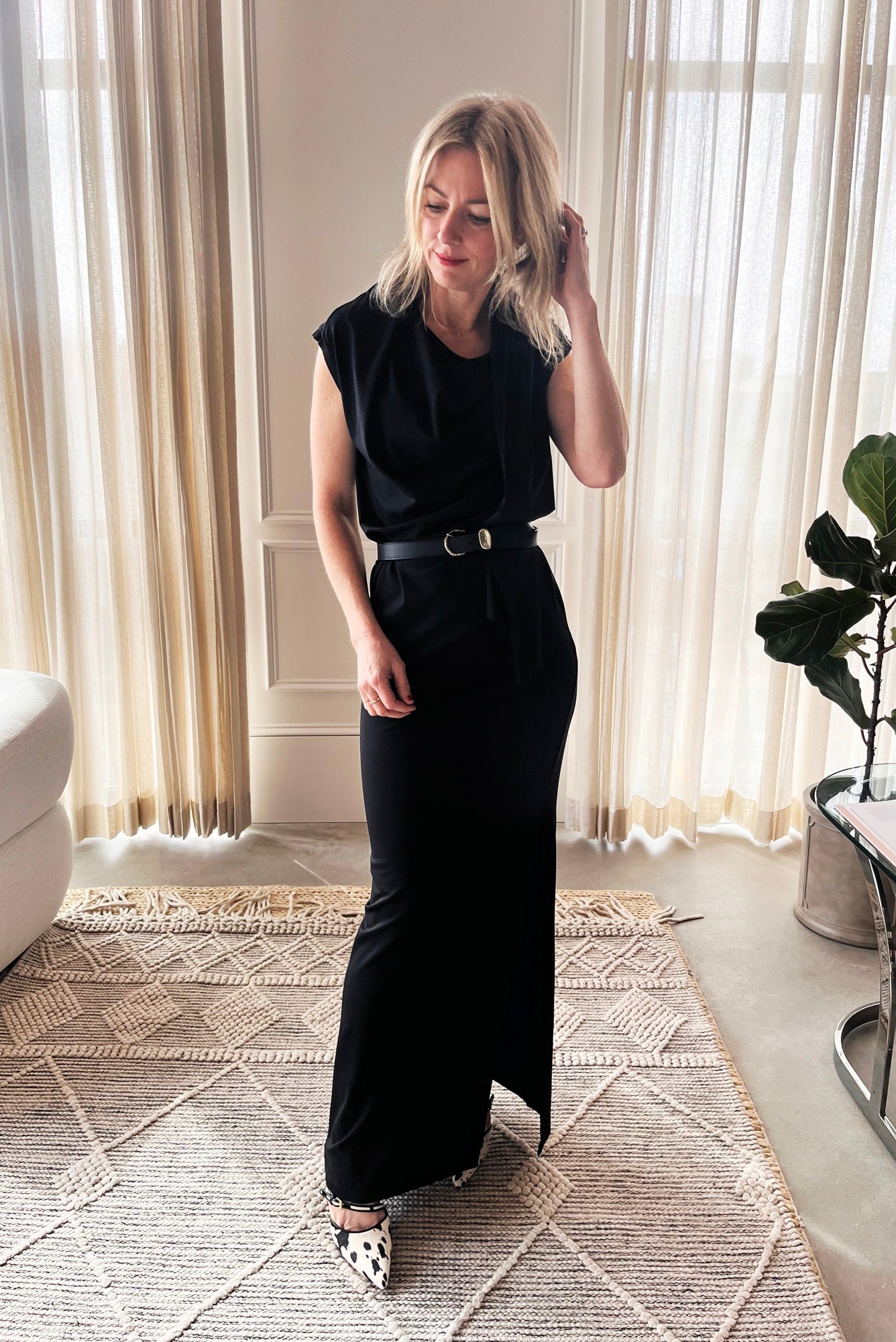 image of a woman wearing the Garment Scarf Dress, janessa leone myra belt and studio amelia alto cow mules