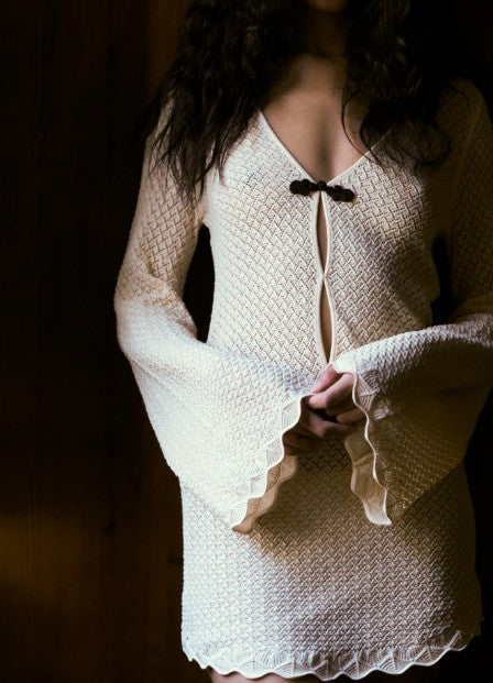 close up image of a model wearing the garment tanzania short dress
