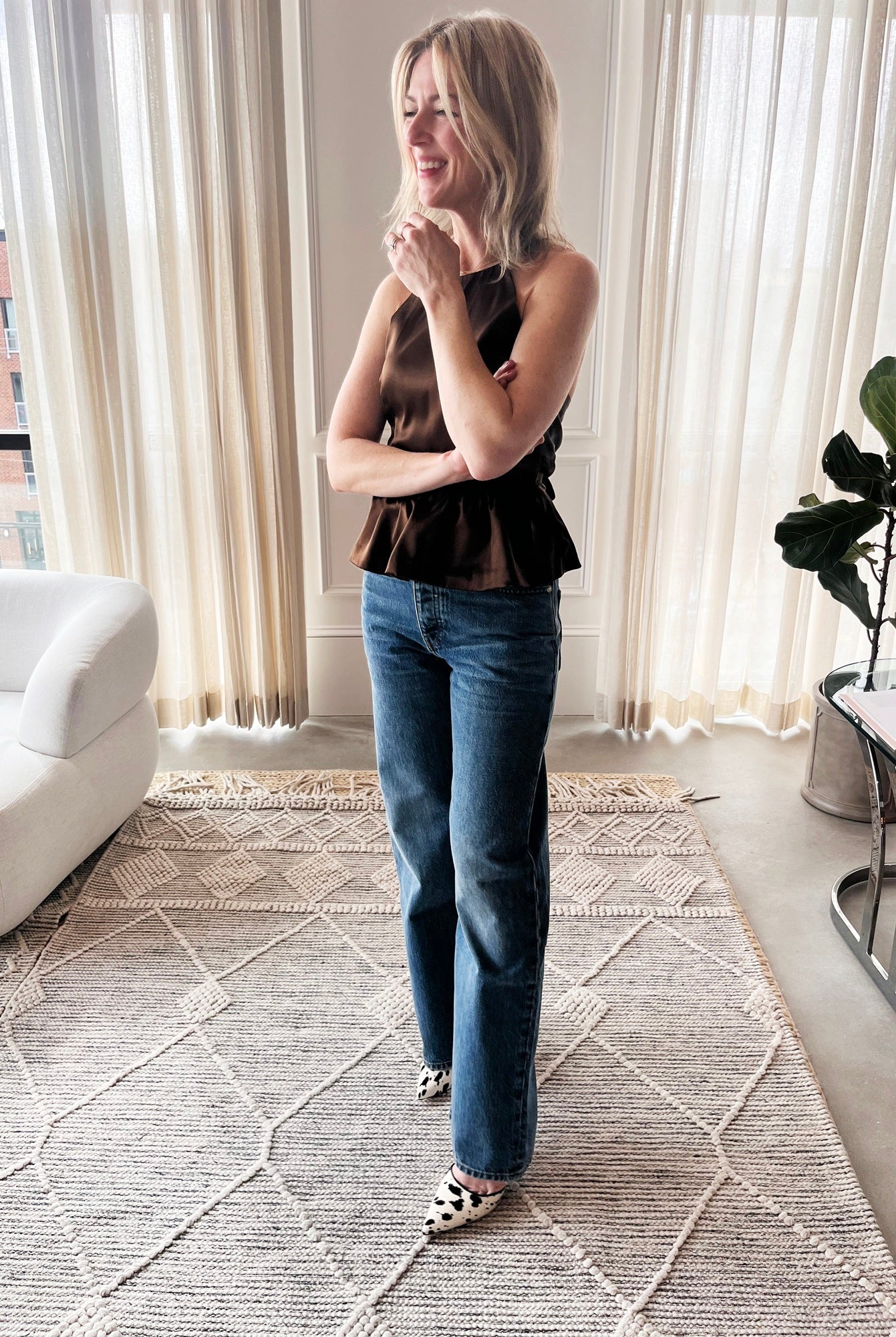 image of a woman wearing the Garment Tie Back Top and Sablyn Sammy Jeans