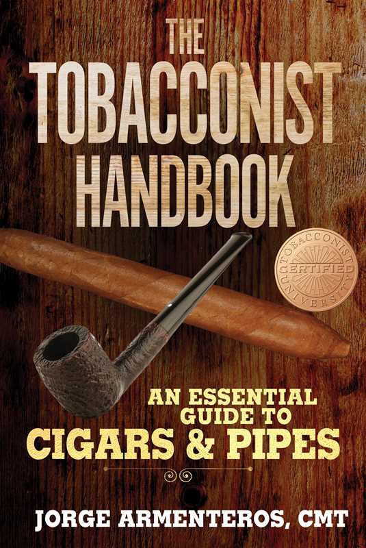The image features the cover of "The Tobacconist Handbook" by Jorge Armenteros. The book's cover displays a rustic, wooden backdrop with a prominently displayed pipe and a cigar, symbolizing the subject matter.