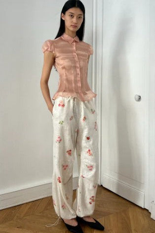 image of a model wearing the Alfie Grace Pants in Rose Sequin