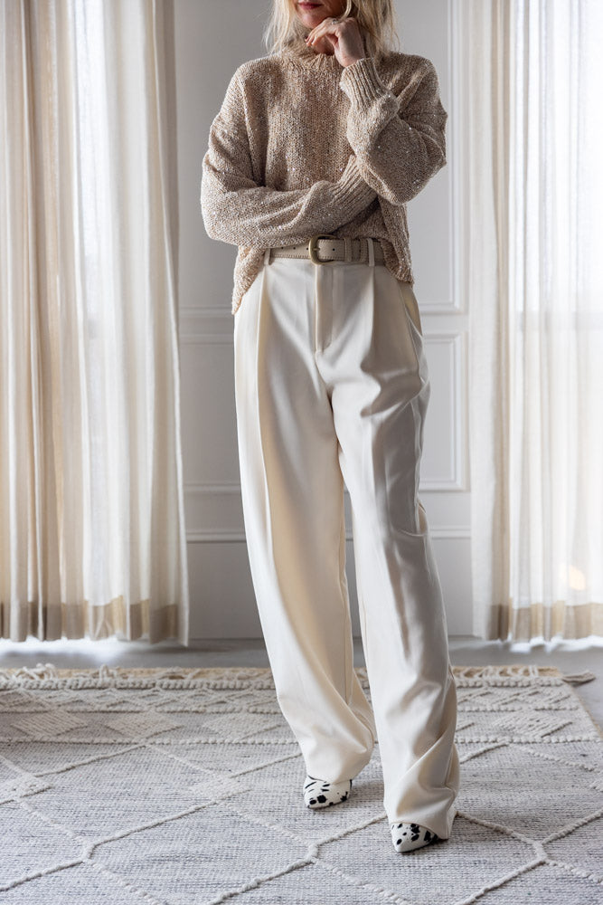 image of a woman wearing the Alysi Sequin Sweater and Seroya Sonya Pants