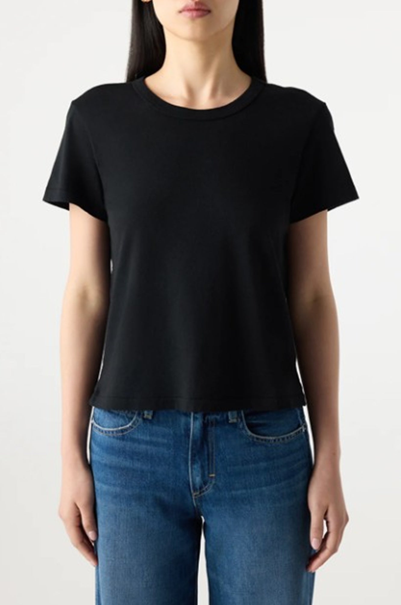 image of a model wearing the amo lovey tee in black