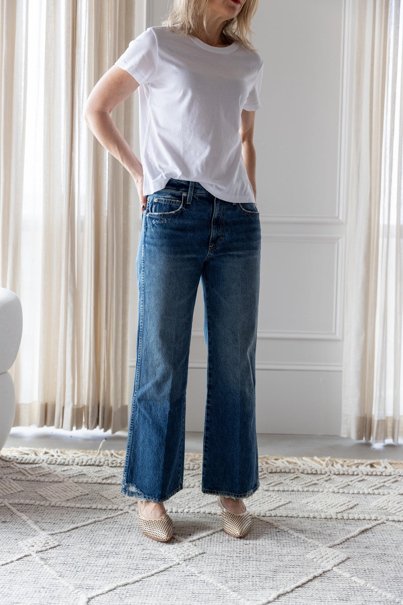 image of a woman wearing the Amo Lovey Tee in White and Robbie Jeans