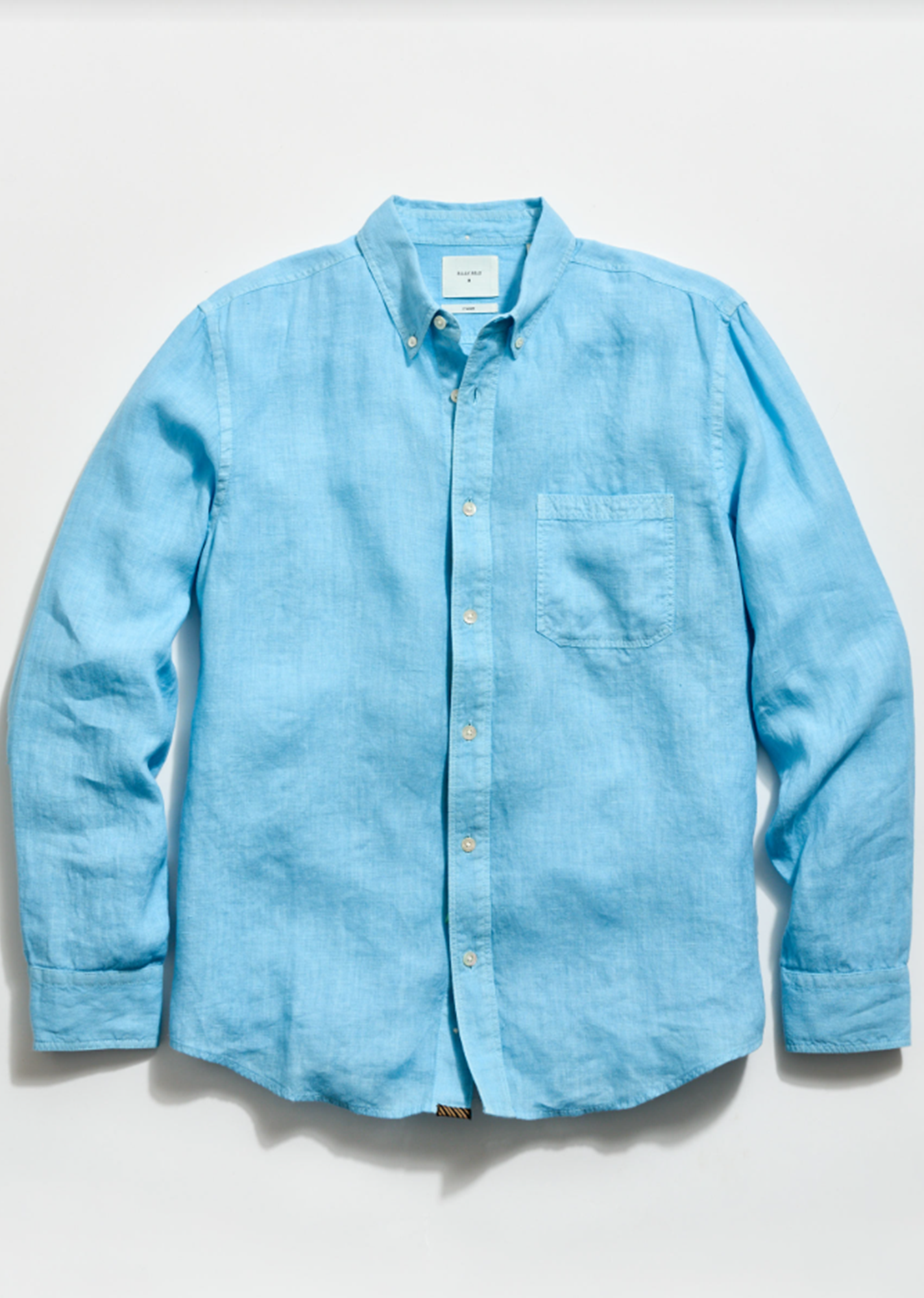 Light blue button-up shirt on a white background