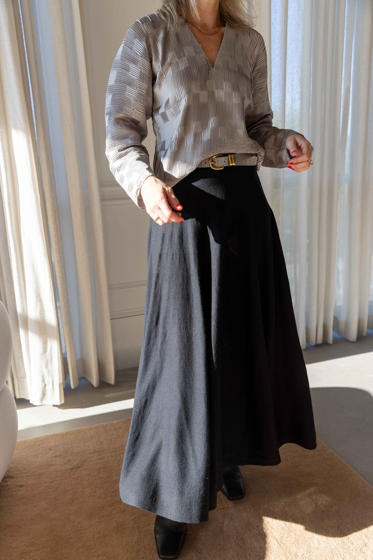 by Malene Birger Franca Top in paloma grey satin with dolman sleeves, belted with the Zoilo Belt over the black Geri Skirt