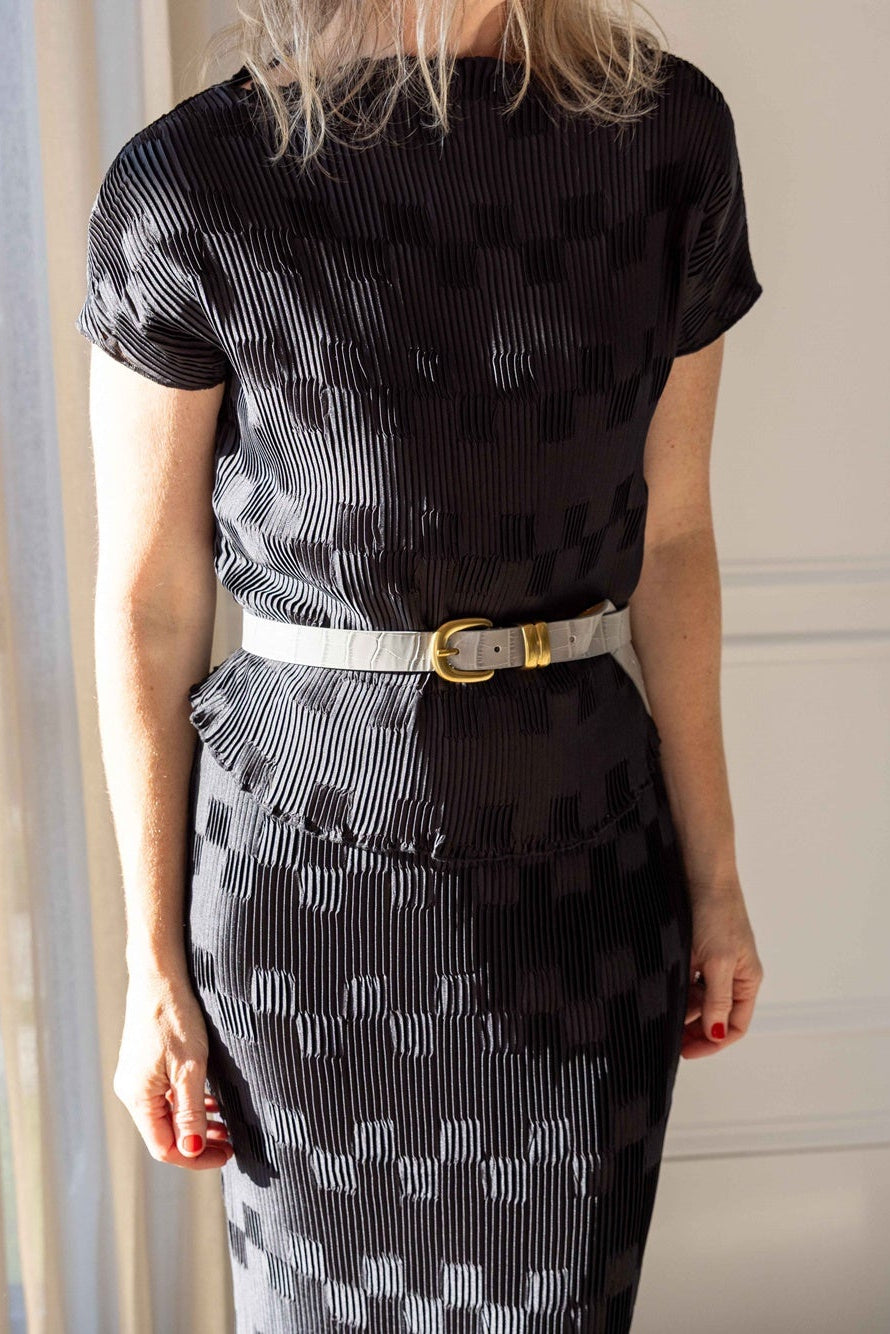Close-up of the by Malene Birger Lianna Top and Lian Maxi Skirt in black crinkled pleated satin, cinched with a Zoilo Belt
