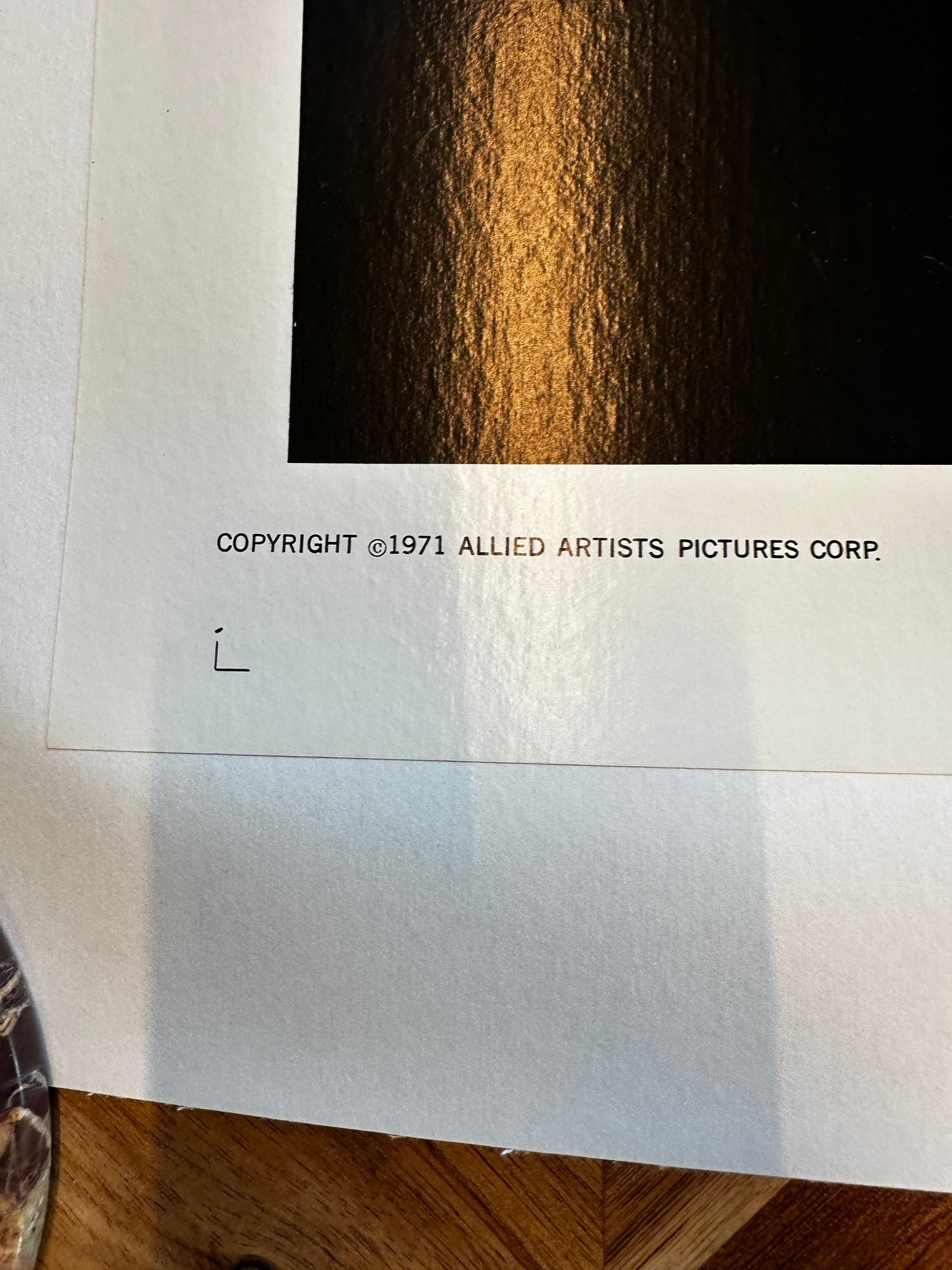 Cabaret Poster Copyright notice for Allied Artists Pictures Corp. on a piece of paper with a dark background.