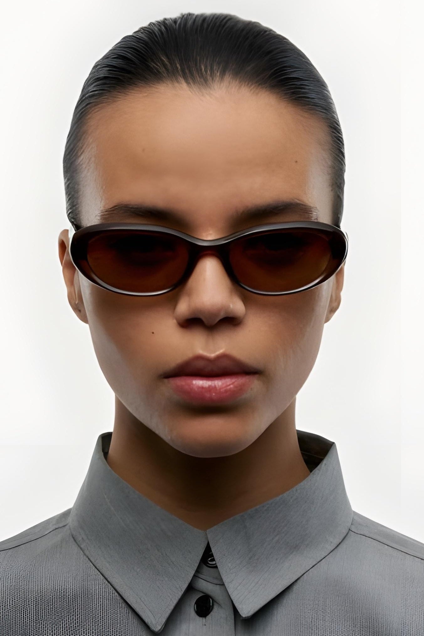 Women wearing sunglasses against a white background 