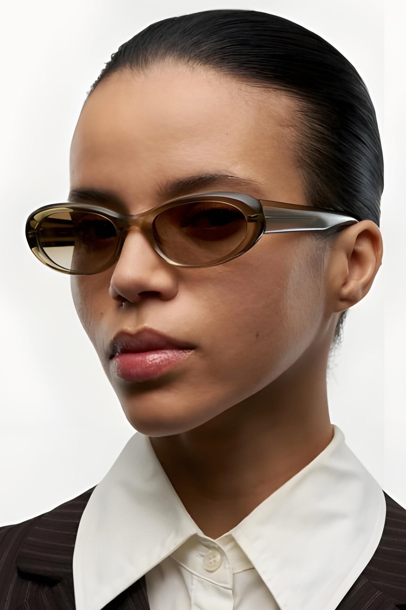 Women wearing sunglasses against a white background 