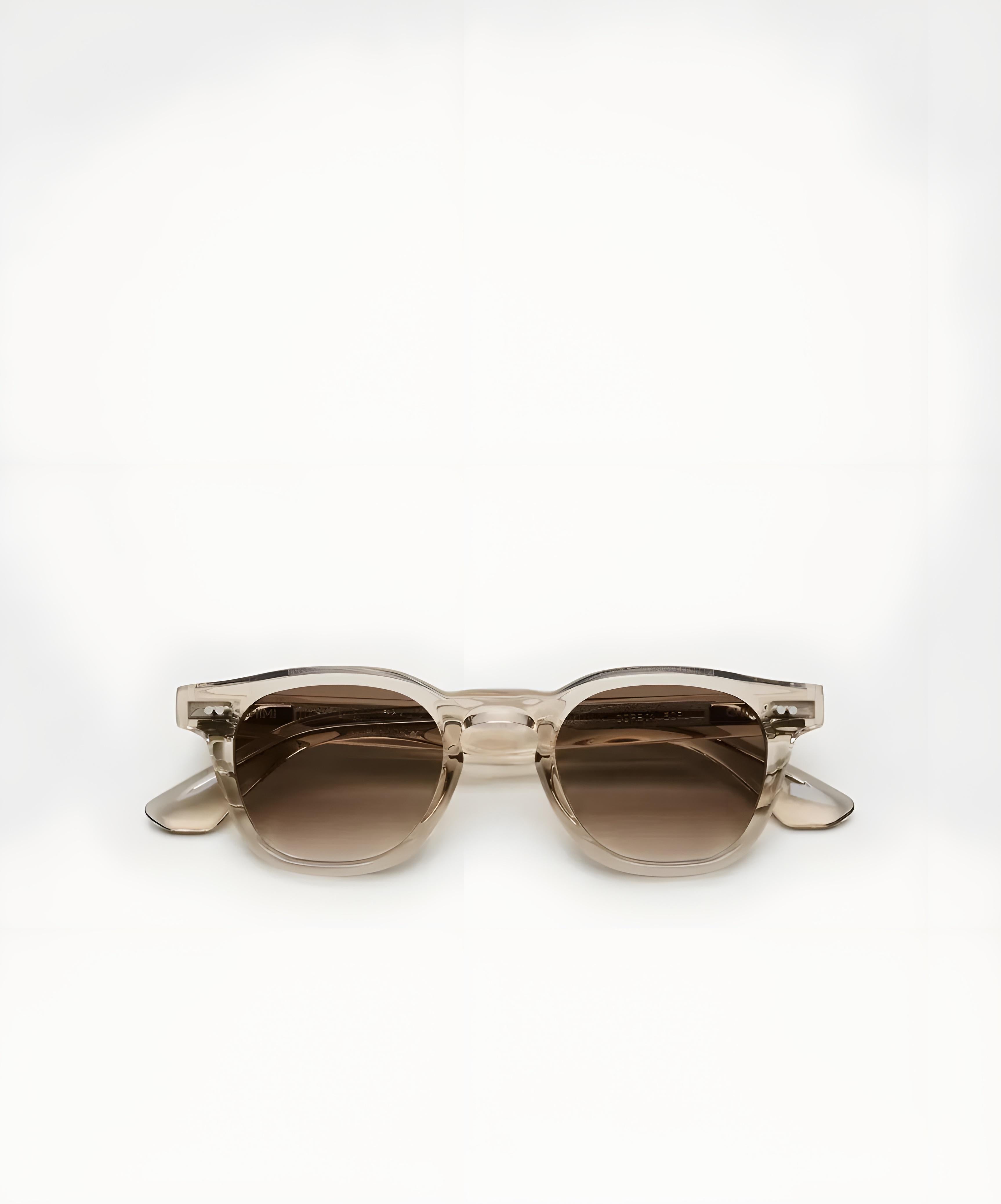 Sunglasses with a gradient brown lens on a white background