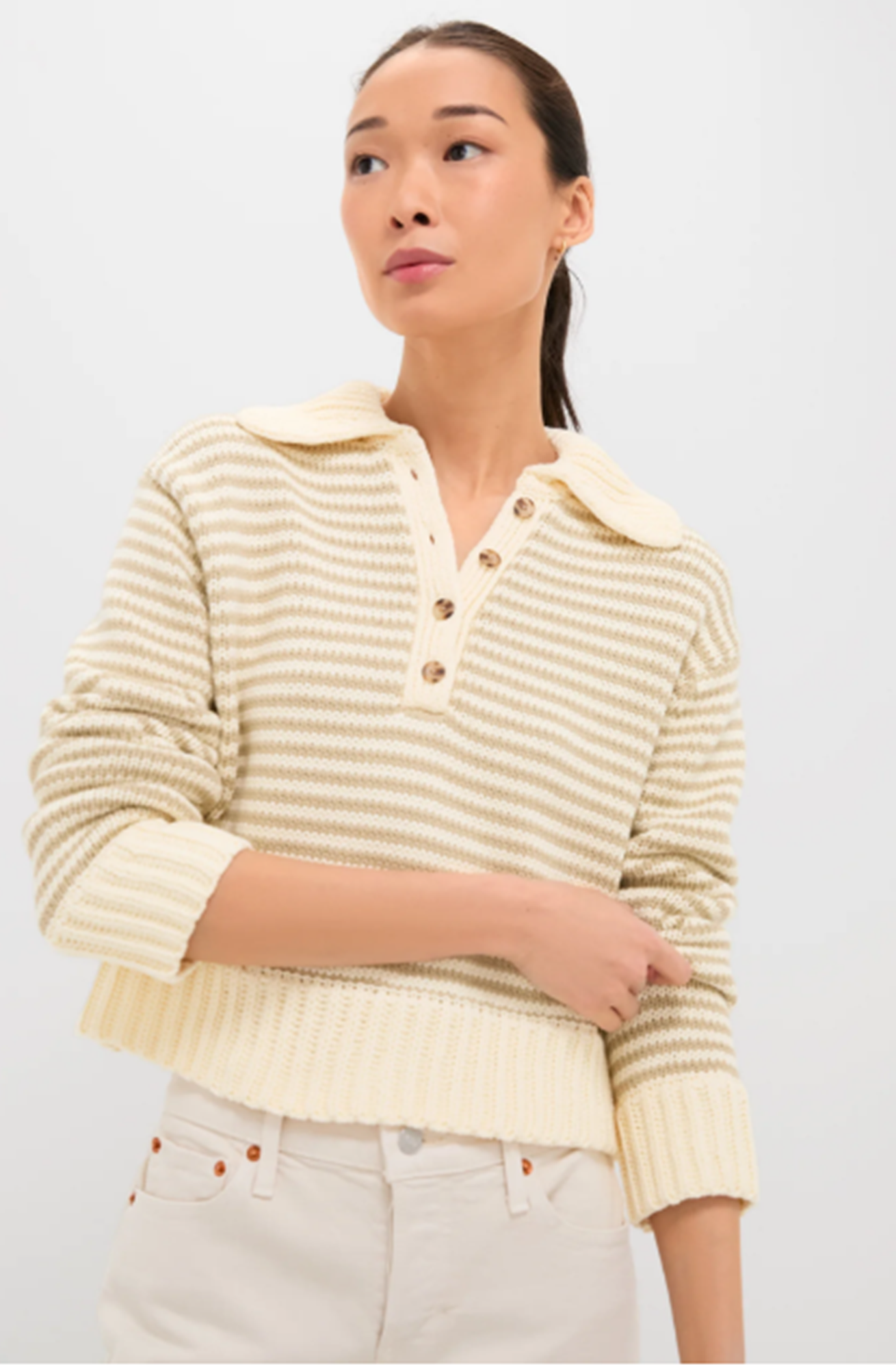 model wearing ciao lucia doro striped henley sweater.